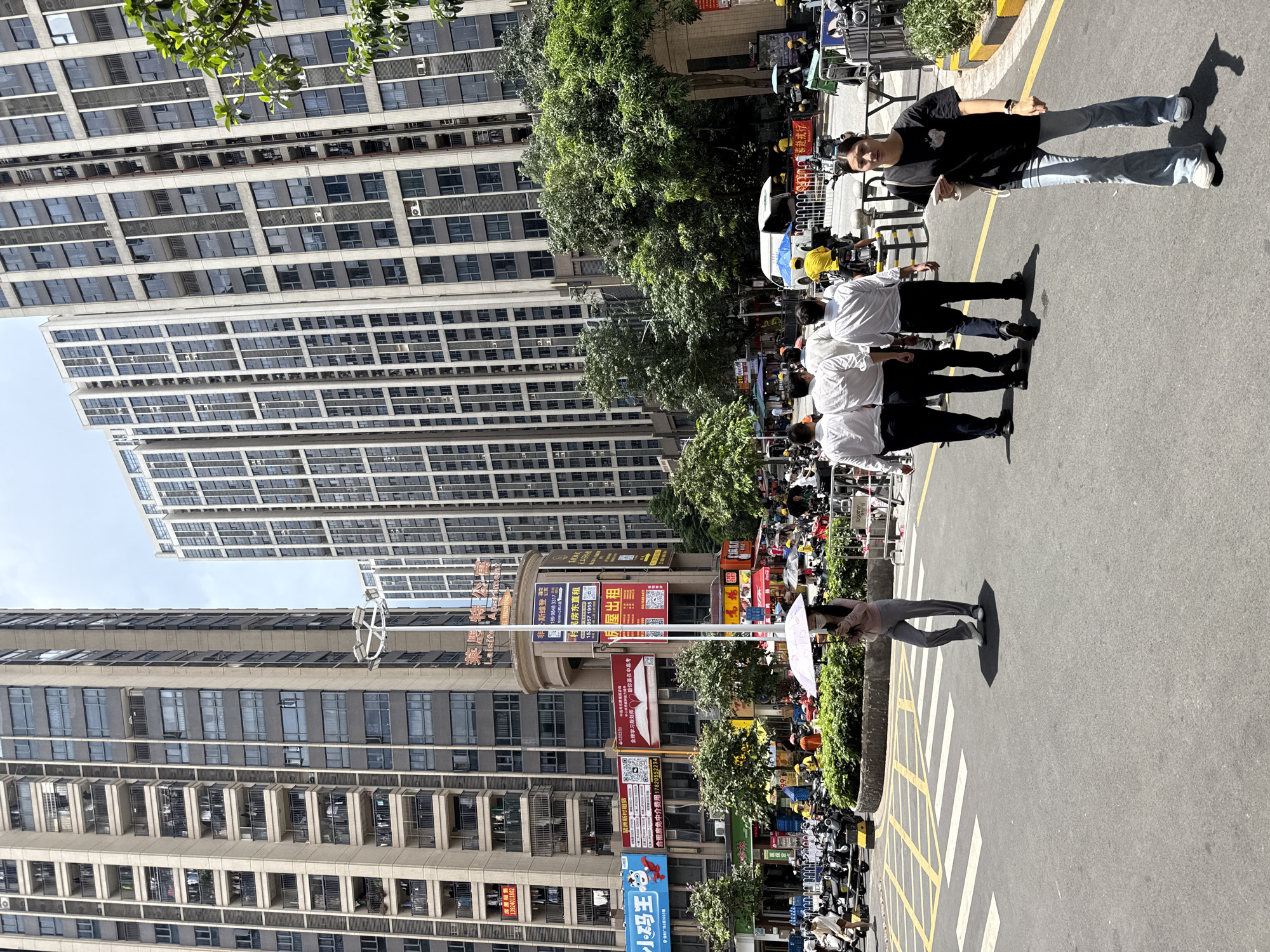 Haizhu District street life: scooters, bakeries, and mall retail
