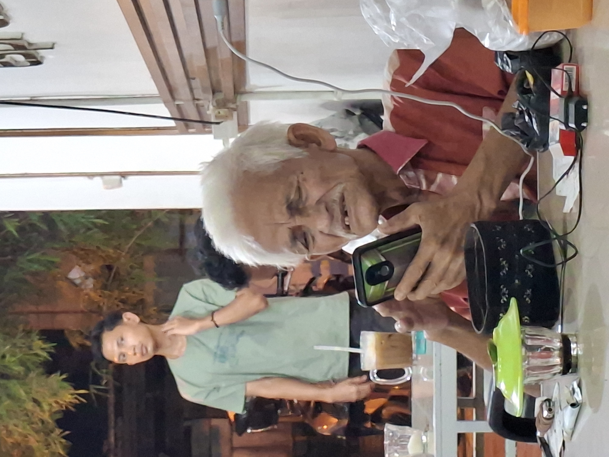 Elderly man enjoys coffee break at Lhokseumawe cafe