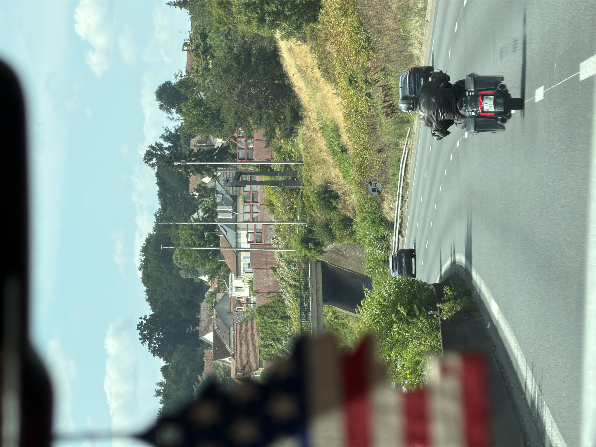 On the road in Savigny-sur-Orge, car and motorcycle in motion