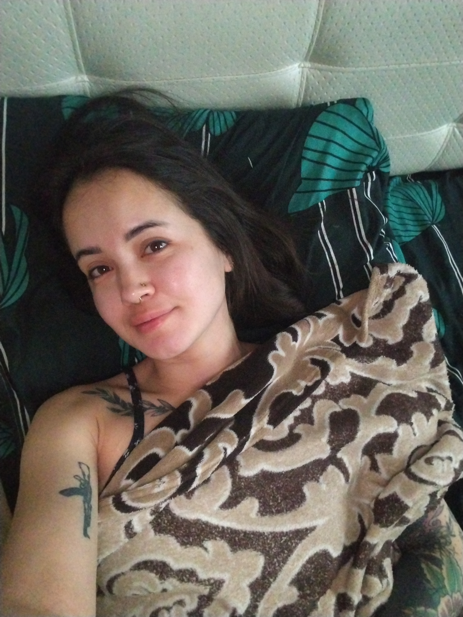Woman rests in bed in Noviy, Russia