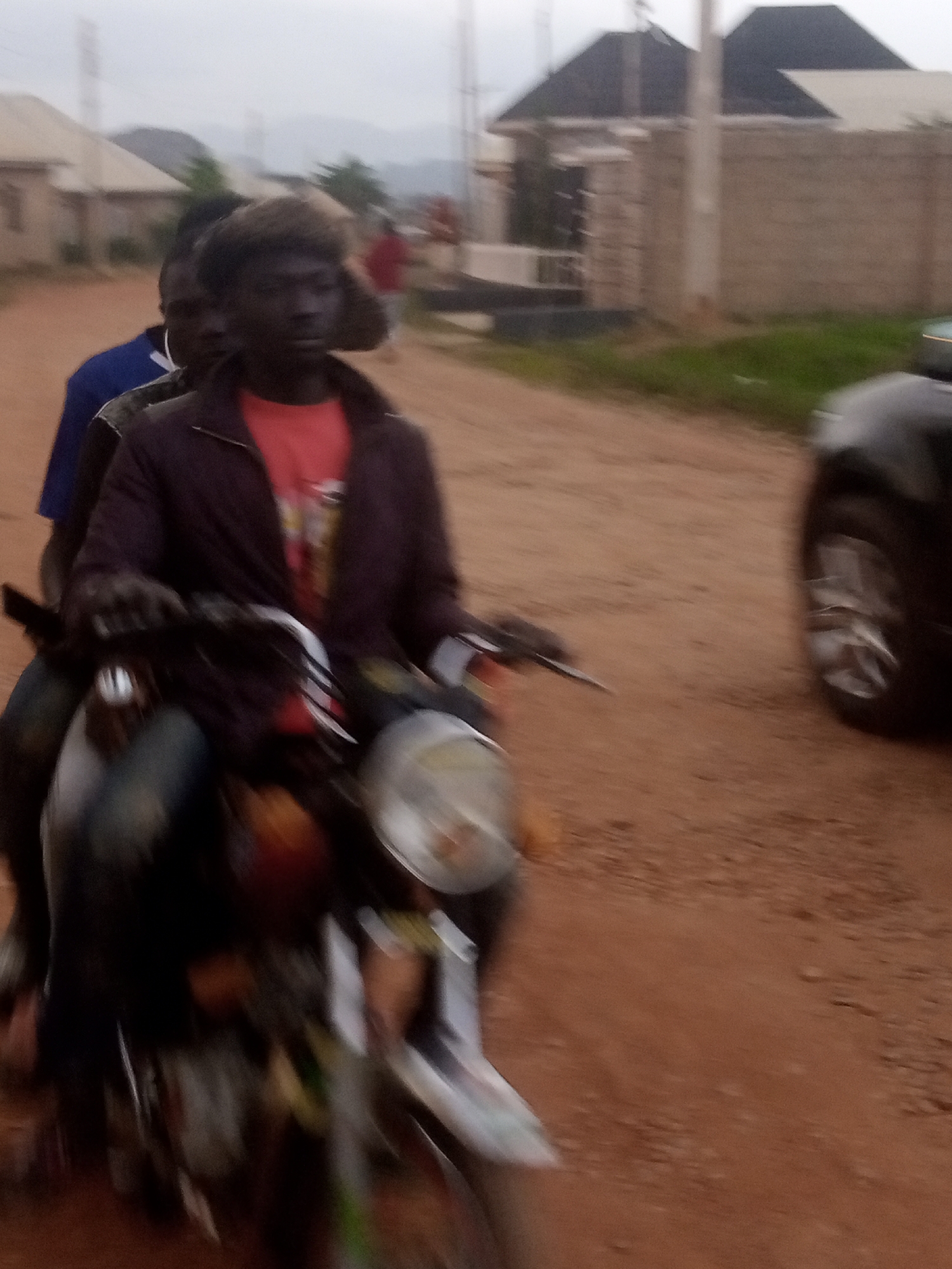 Group handles gas cylinders and street activity in Nigerian urban setting