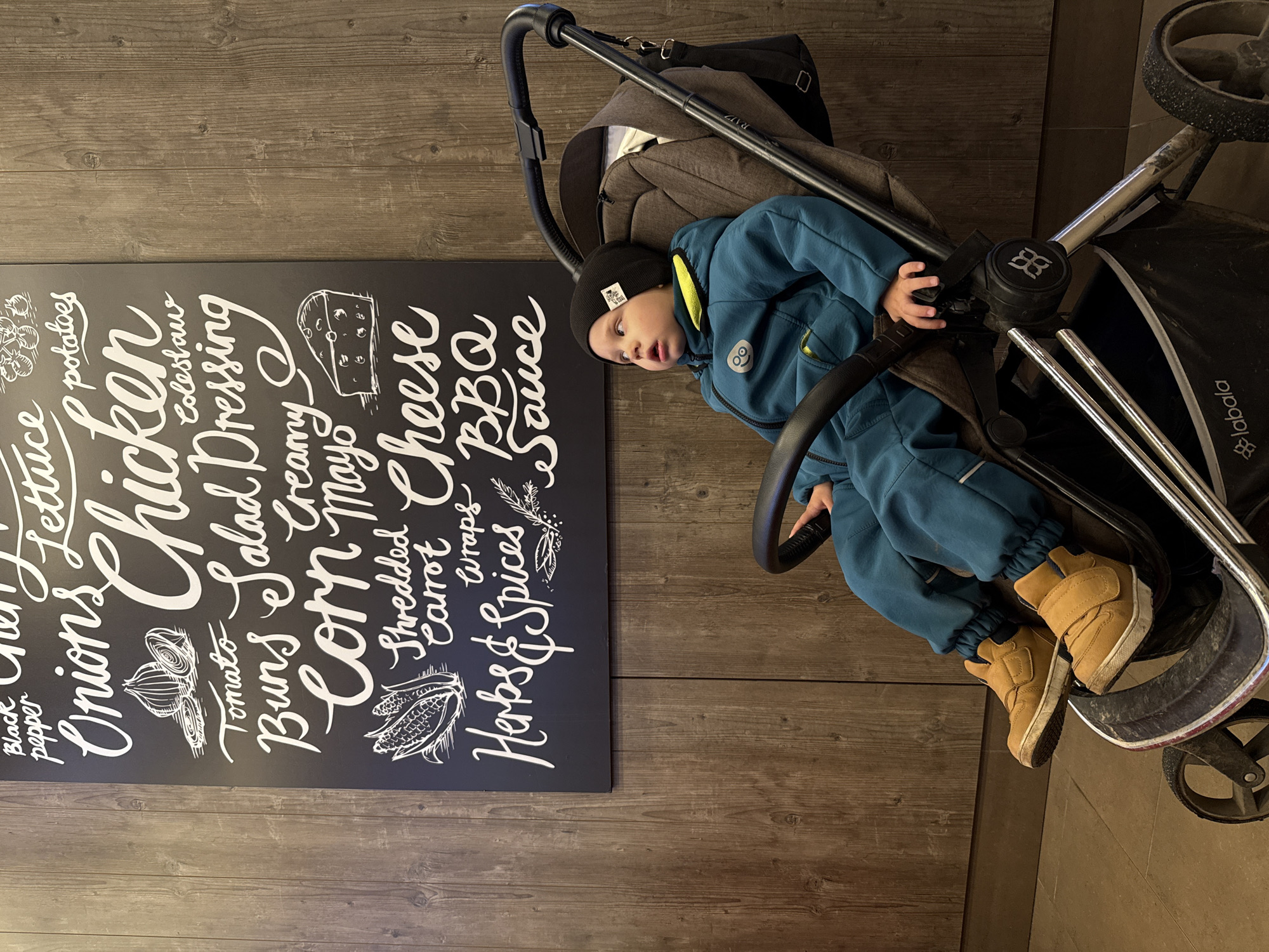Family dining at Russian fast-food restaurant with toddler