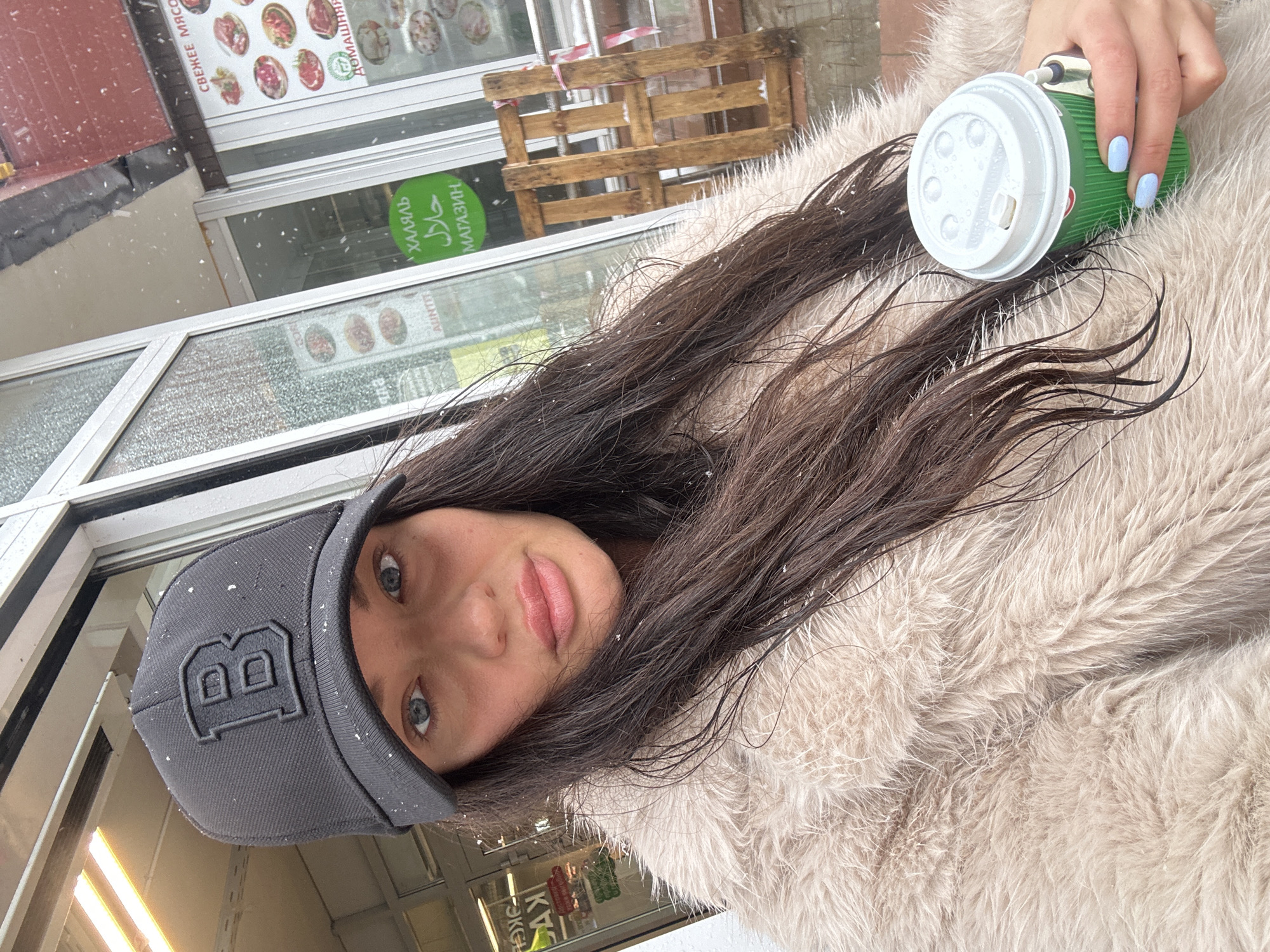 Woman with coffee cup spotted outside Moscow building