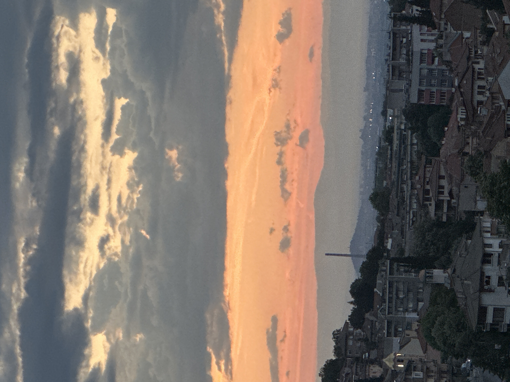 Dramatic sunset clouds roll over Asenovgrad from an elevated viewpoint