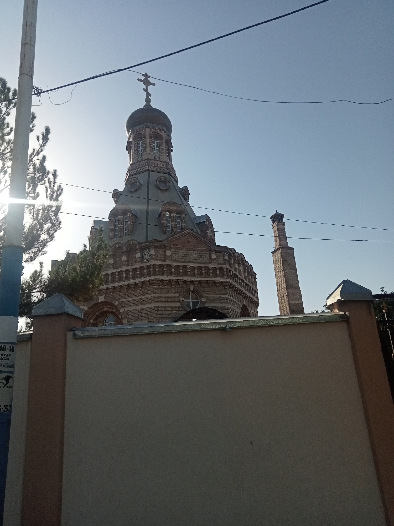 Urban stroll: church, fountain, flowering plants, and city greenery