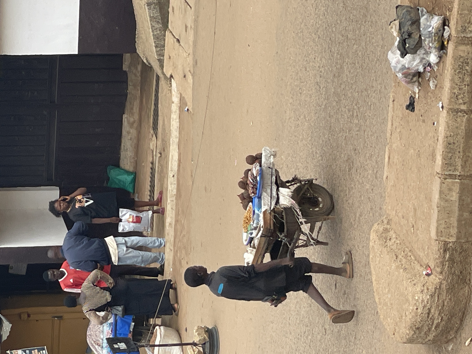 Outdoor market activity documented in unidentified urban area