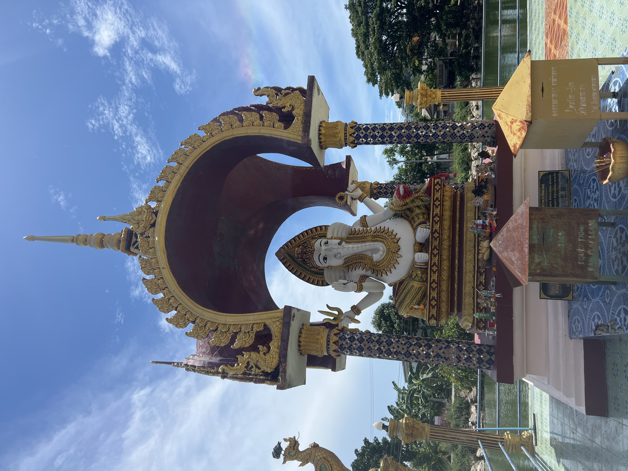 Visitor documents Hindu-Buddhist temple statues and architecture in Thailand