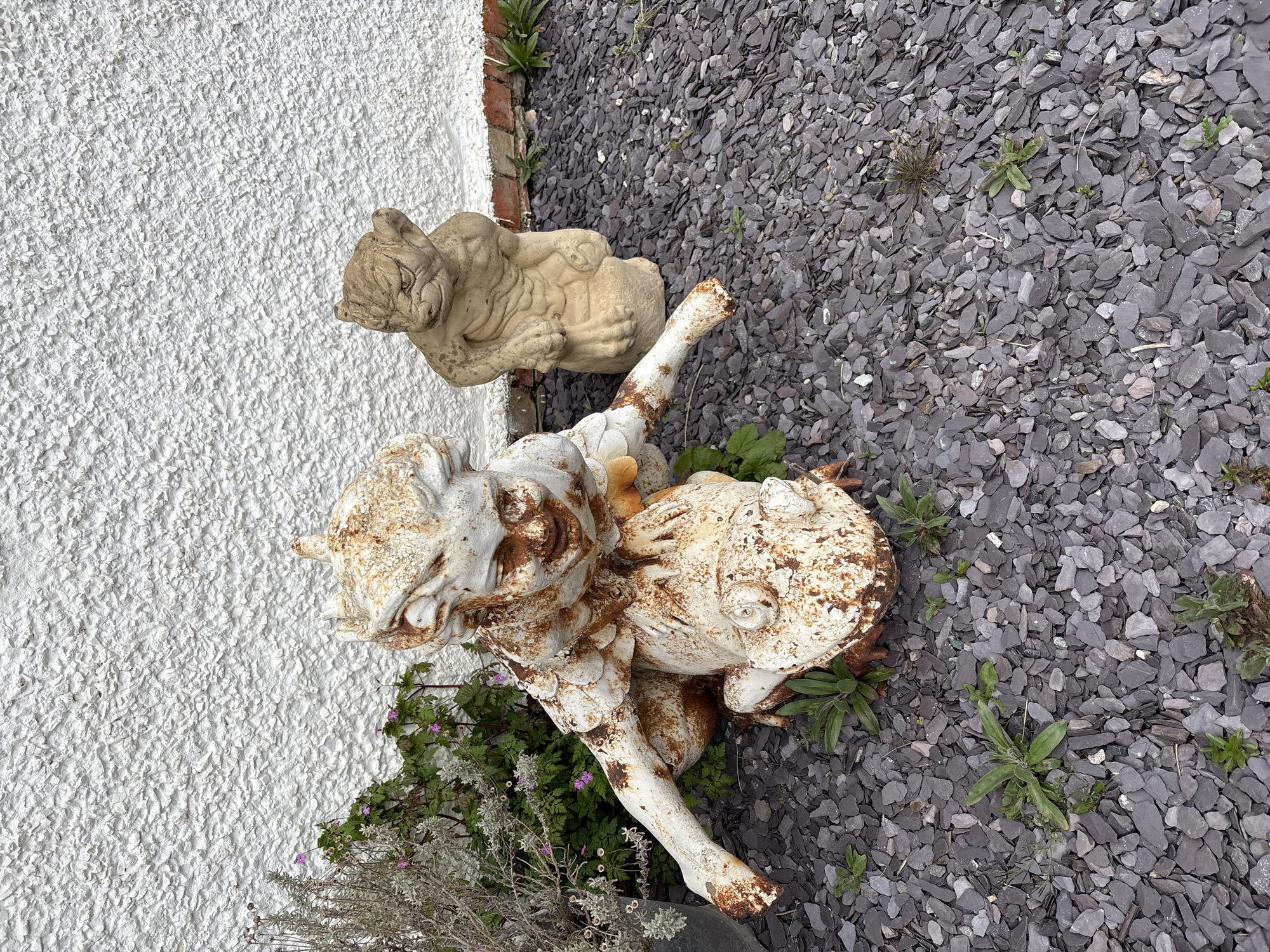 Garden statues observed in Minsterley countryside setting