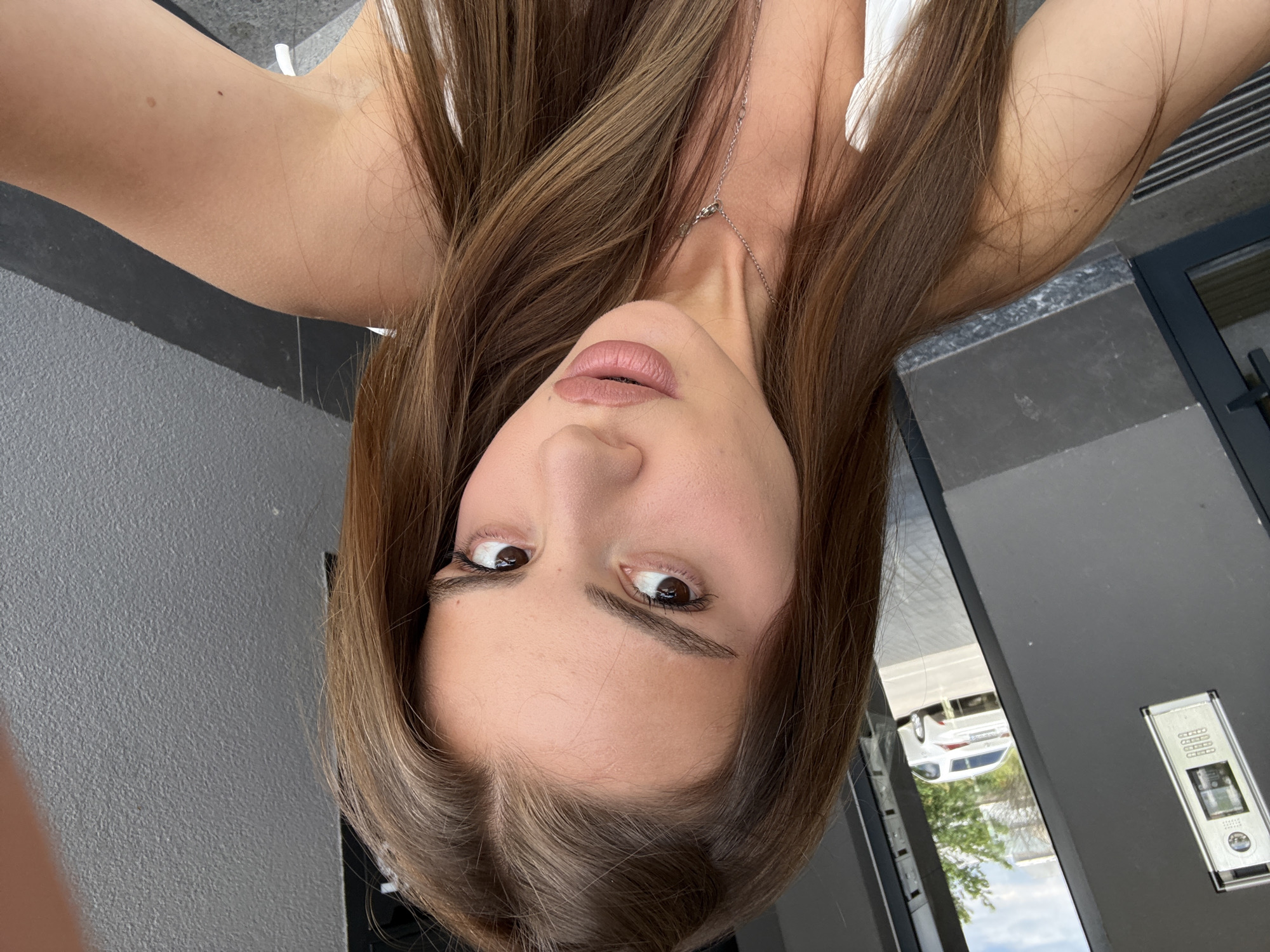 Woman documents morning routine through selfies across multiple locations