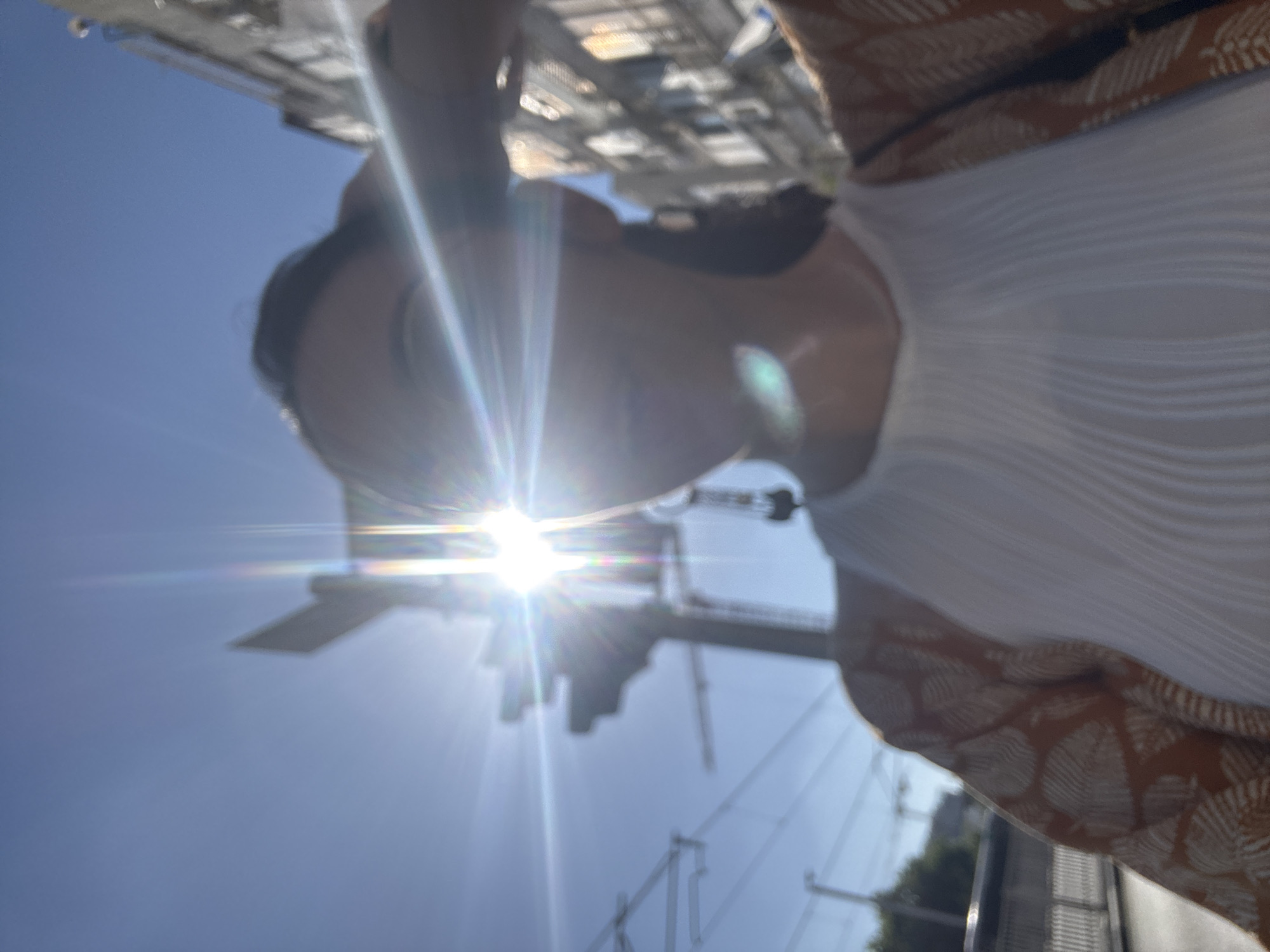Casual afternoon hangout on sun-drenched pavement in Bat Yam
