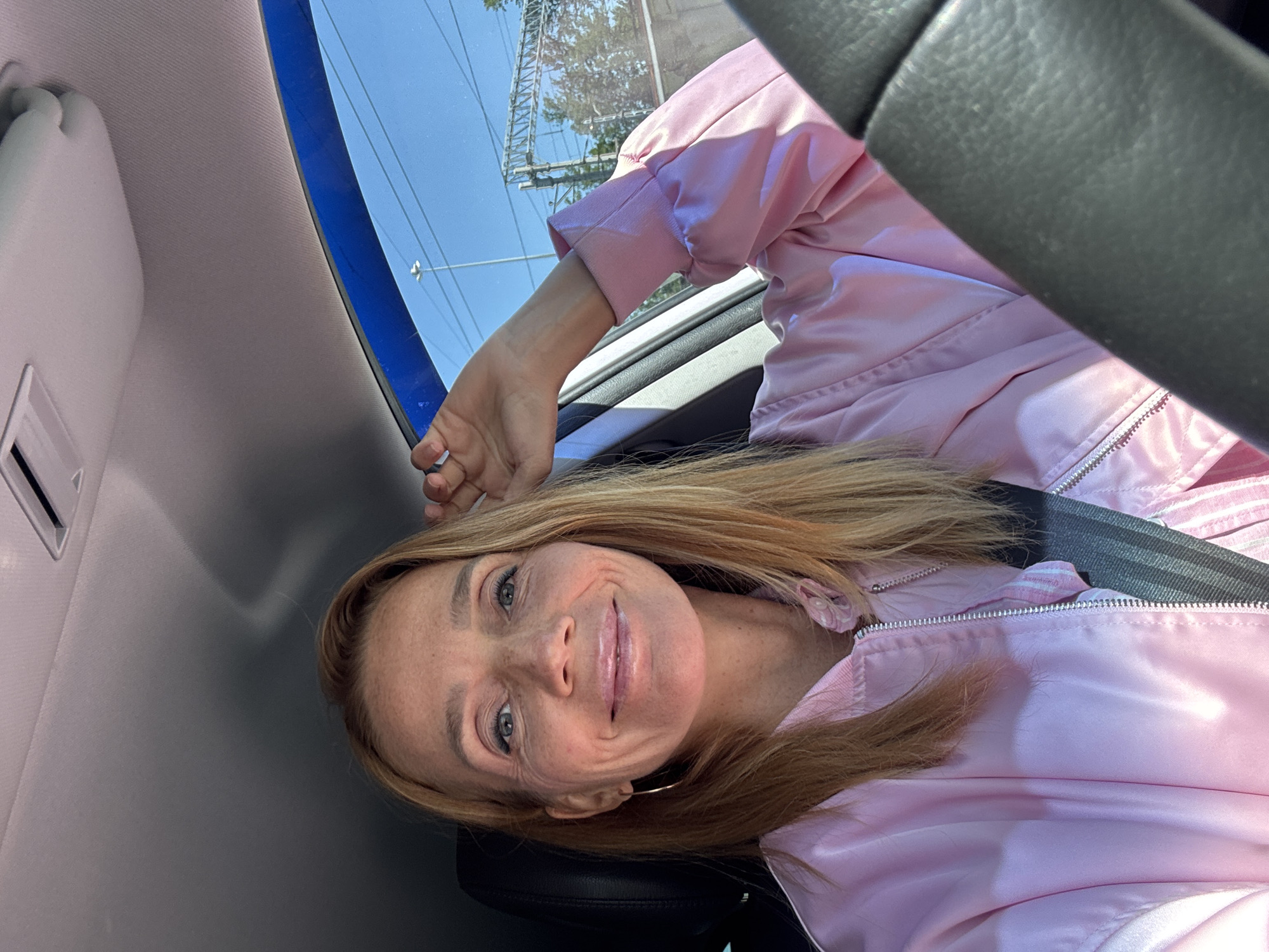Woman enjoys sunny morning drive through Saint Petersburg