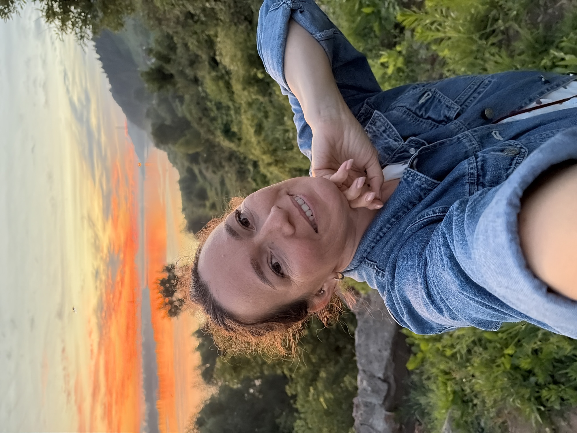 Vivid summer sunset over a calm Russian river