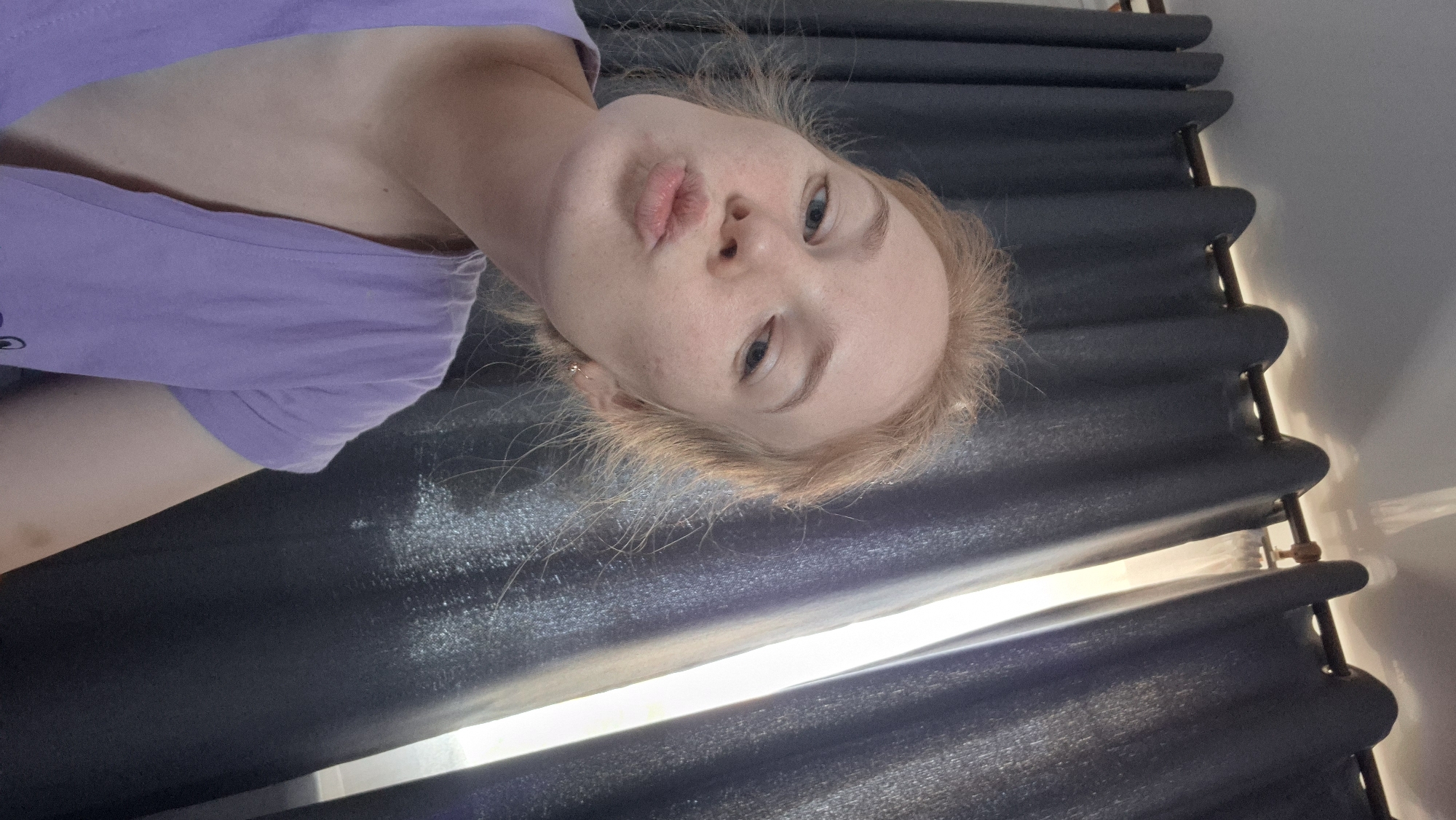 Woman poses for camera in indoor setting in Russia