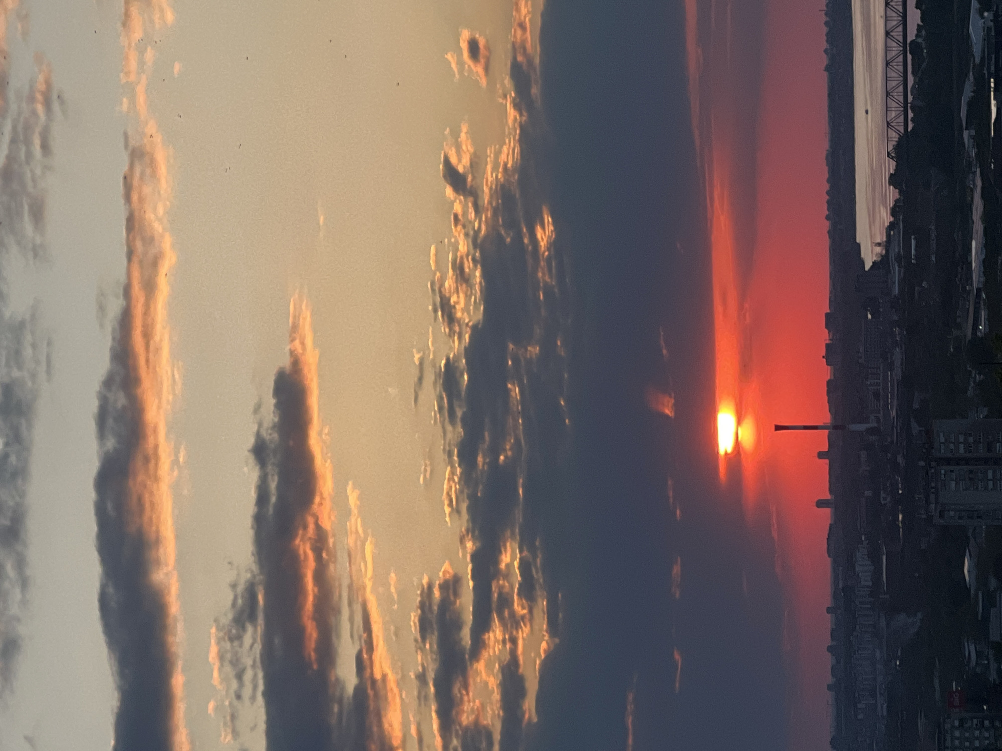 Dramatic sunset illuminates Belgrade skyline and river