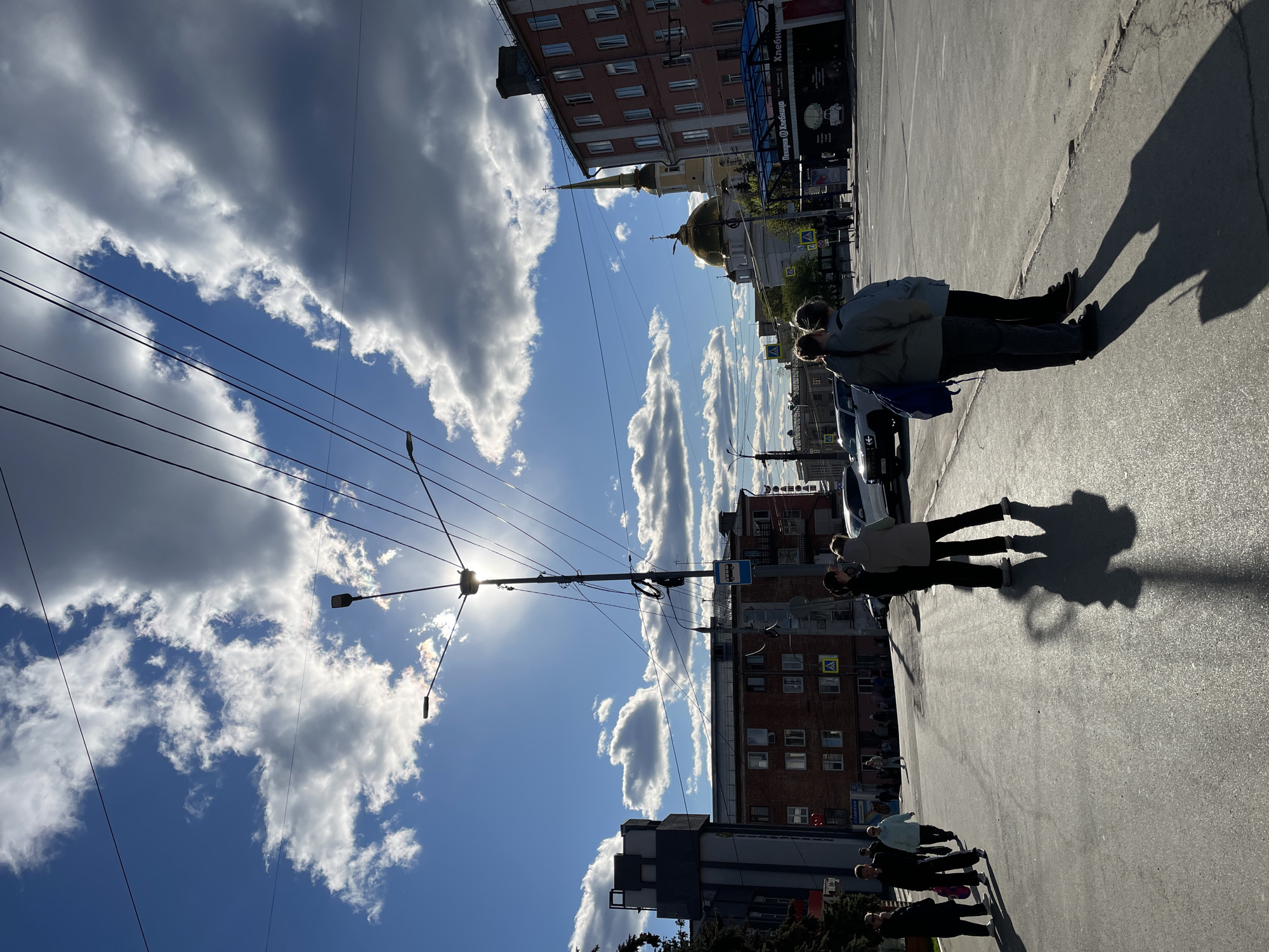 Clear skies and Orthodox church observed in Izhevsk street scene