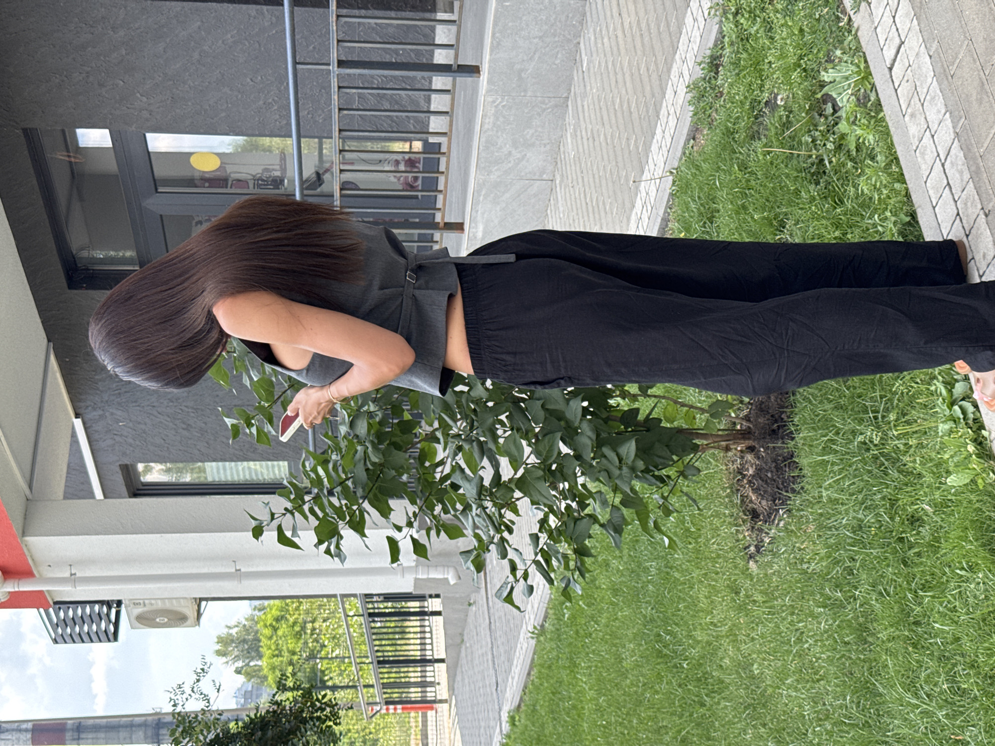 Selfies outside a modern building on a sunny day