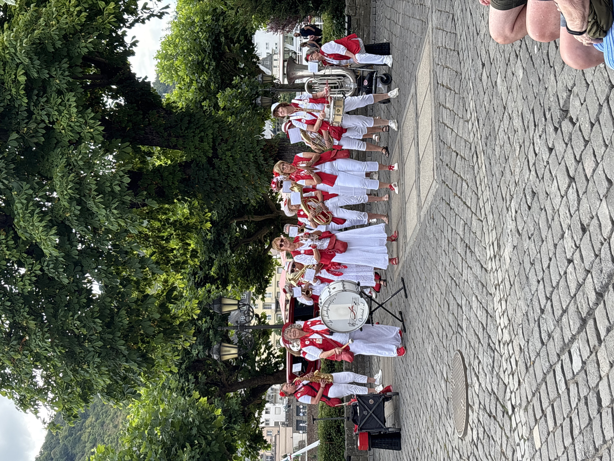 Brass band performs in Cochem's cobblestone plaza by the Moselle
