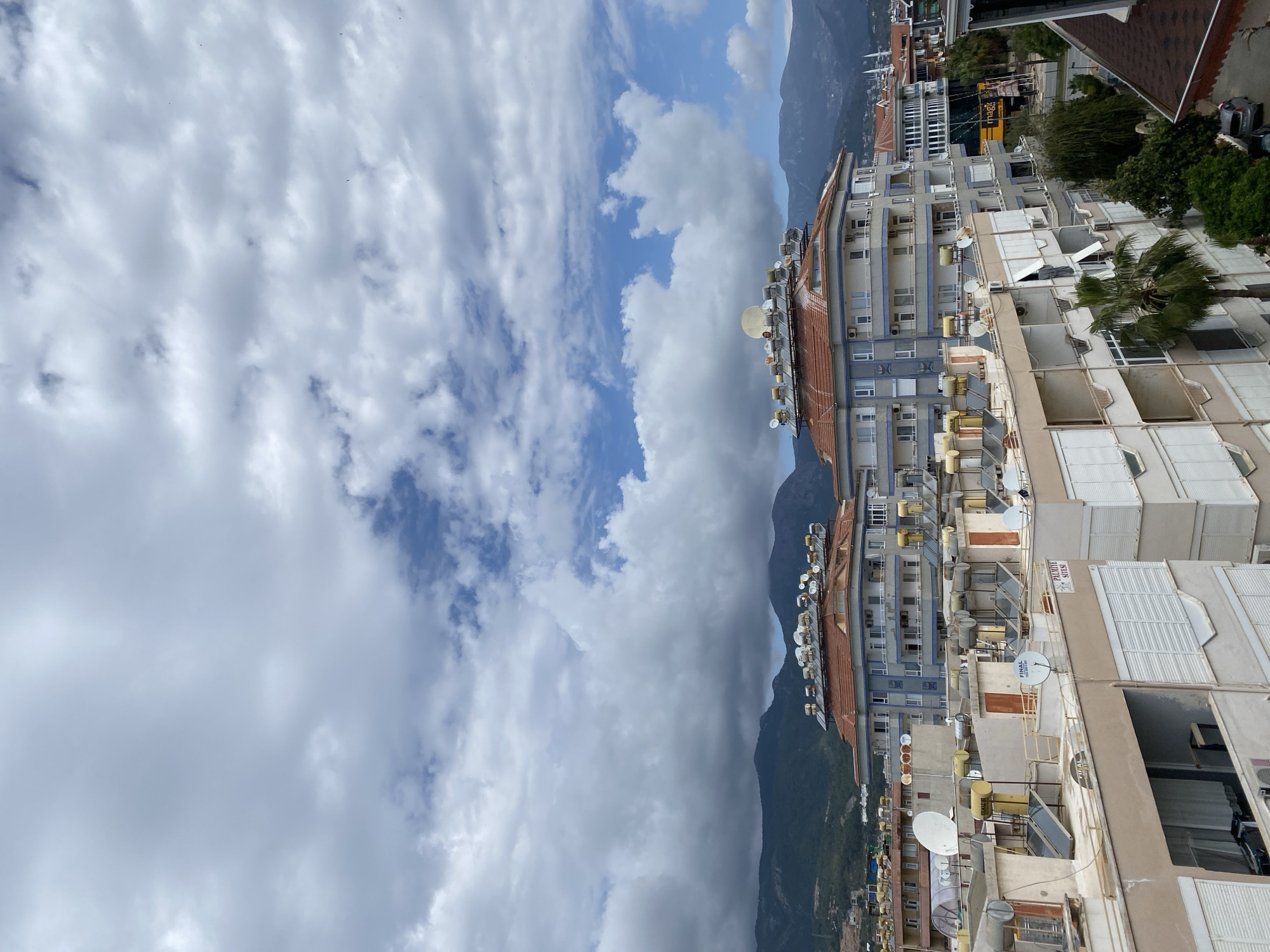 Morning rooftop views document Alanya residential district under cloudy skies