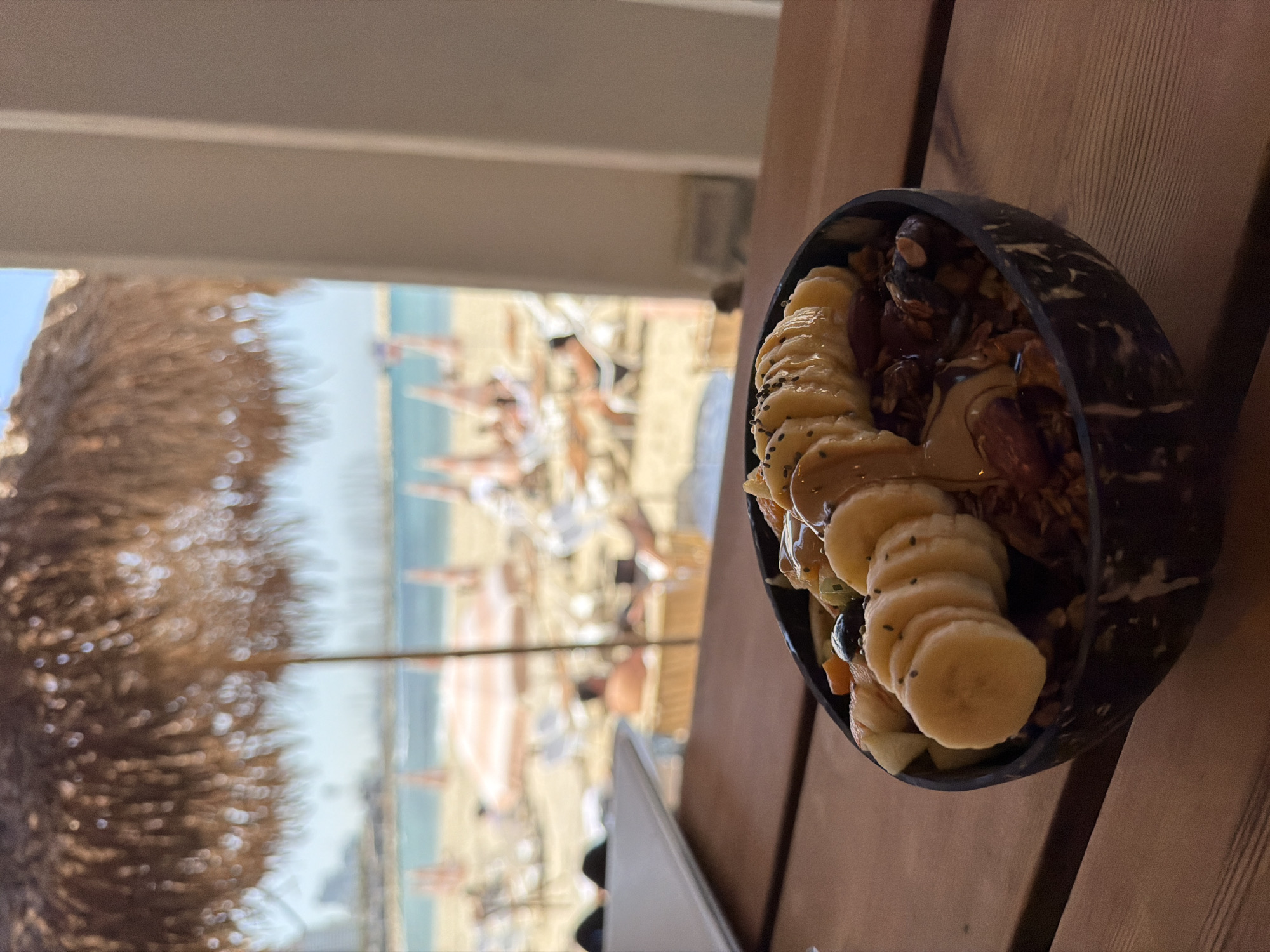 Coconut shell smoothie bowl with banana served in Tel Aviv