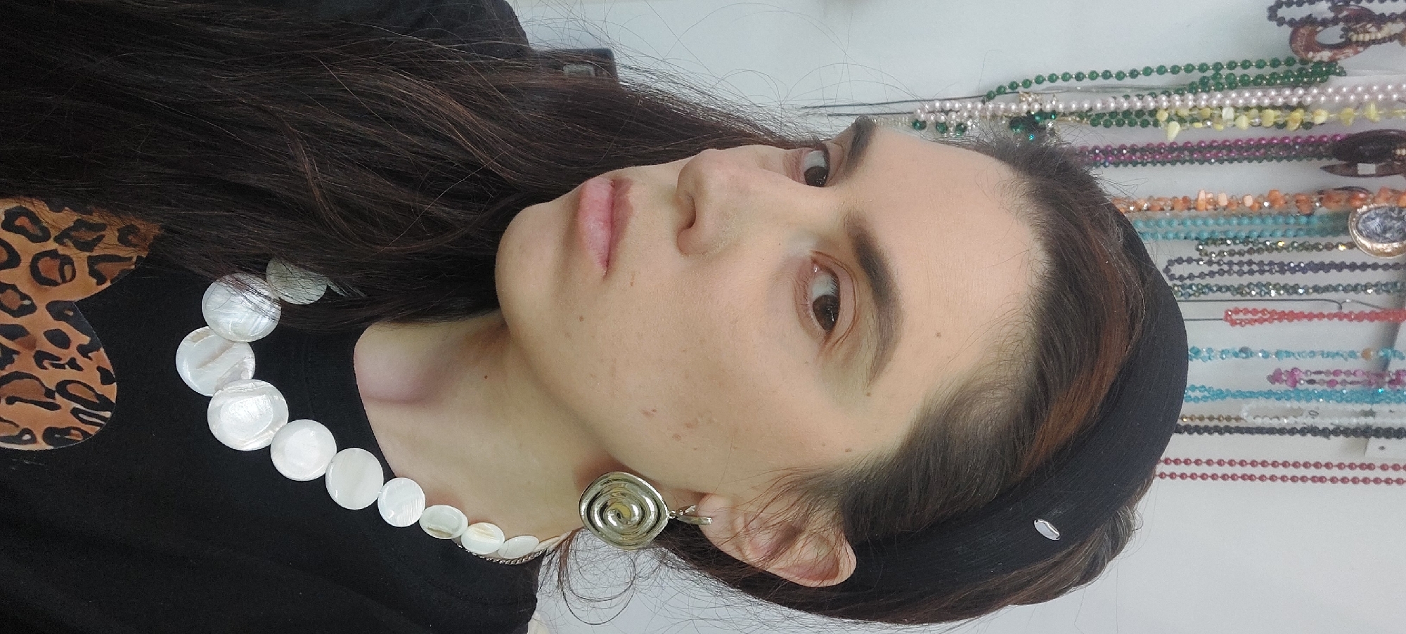 Woman shops for jewelry accessories in Novosibirsk store