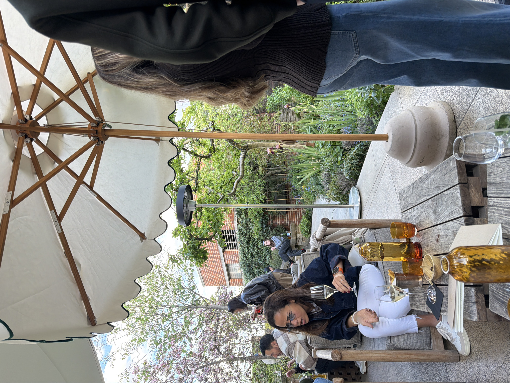 Outdoor dining scene unfolds in London with wine service