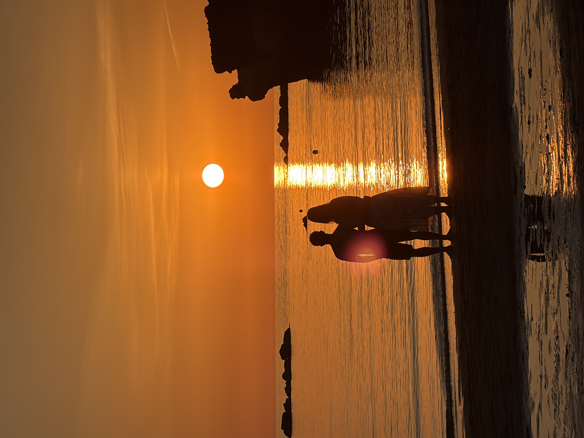 Sunset crowds gather on Anzio's beach along the Tyrrhenian Sea