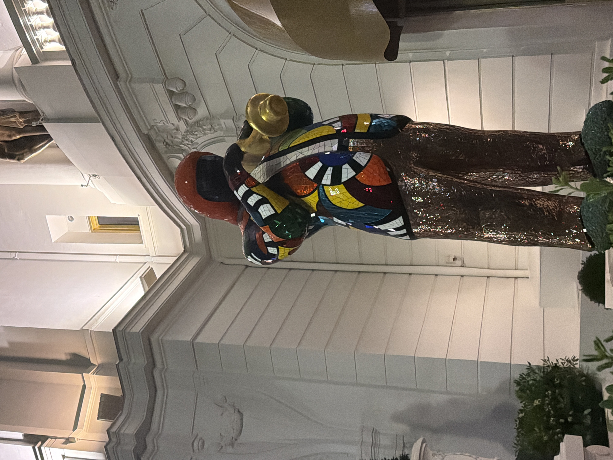 Colorful sculpture and classical architecture documented in Nice evening