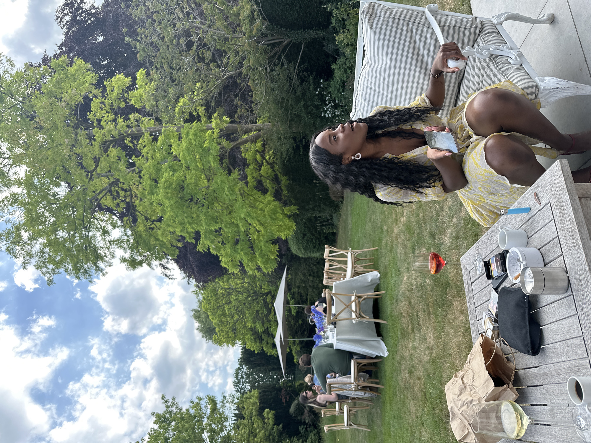 Casual outdoor social gathering documented in Cambridge backyard