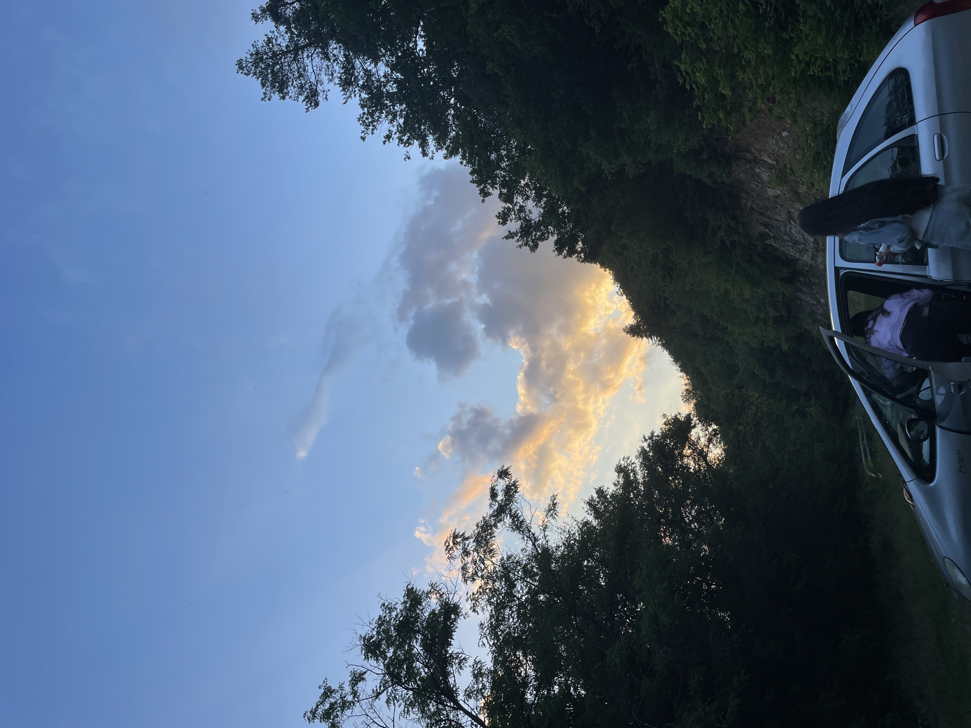 Silver car with doors open, parked on forested road in Zlatograd