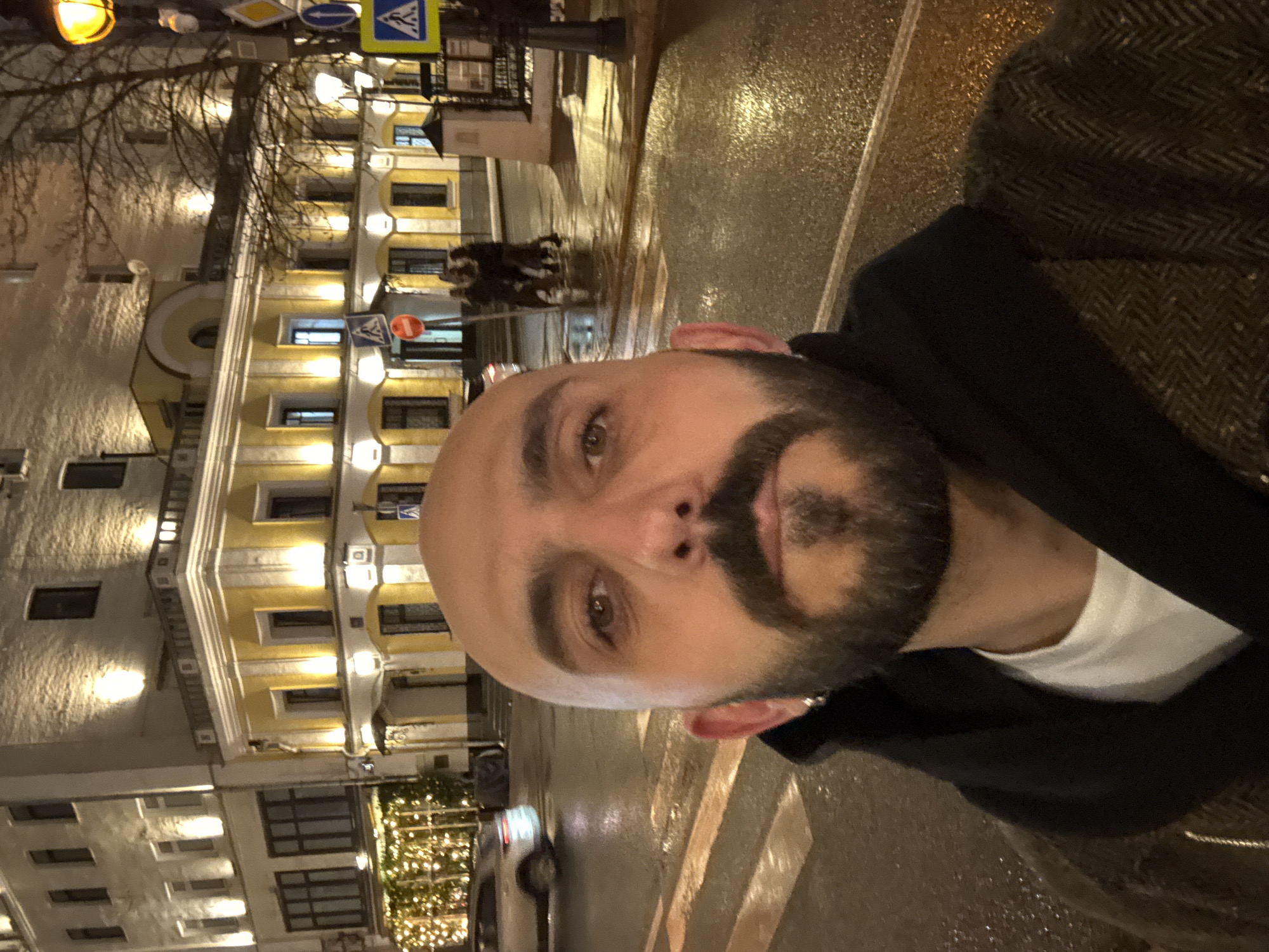 Man takes nighttime selfie on wet Moscow crosswalk
