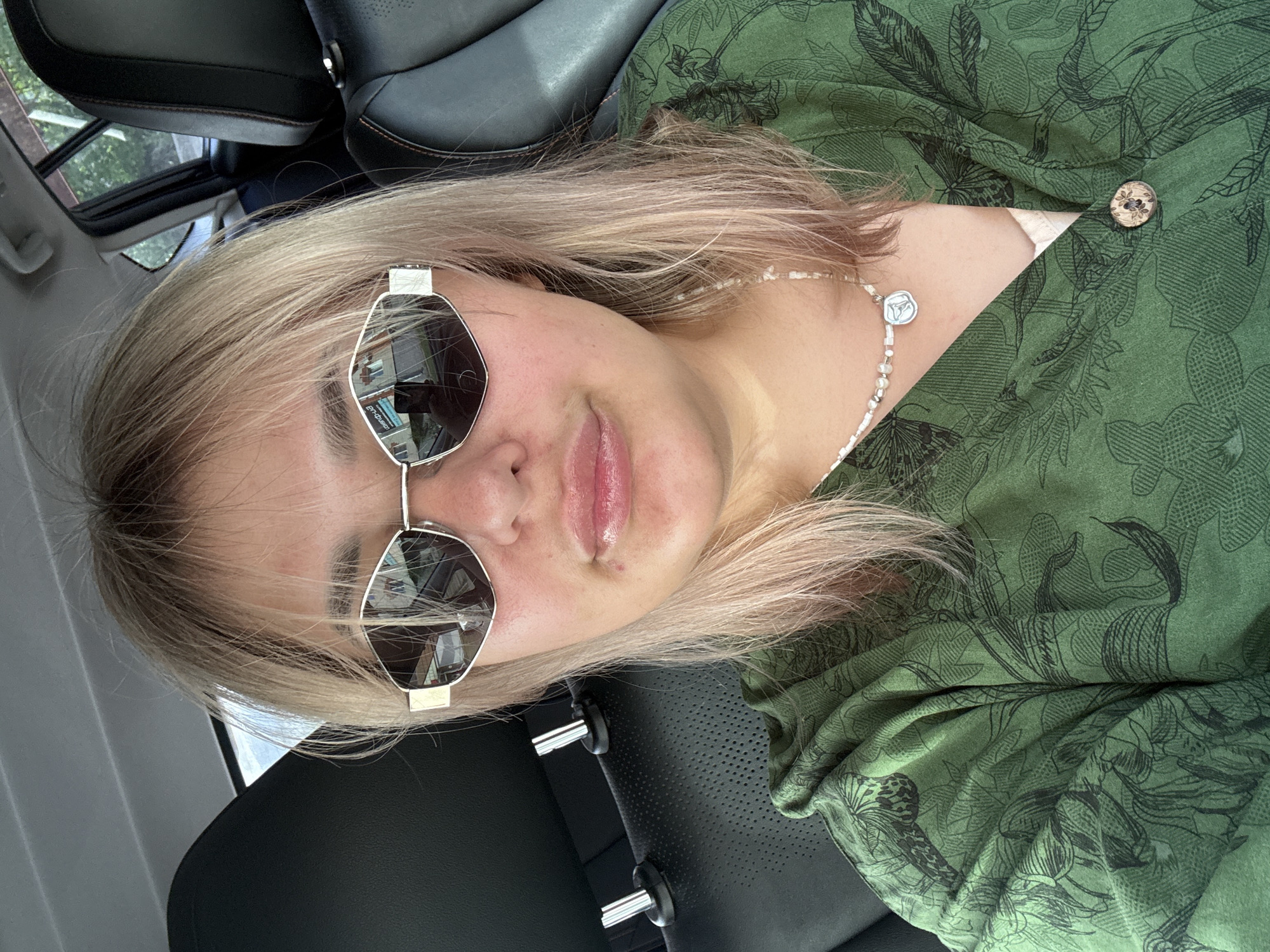 Woman takes selfies in car and outdoors in Birobidzhan