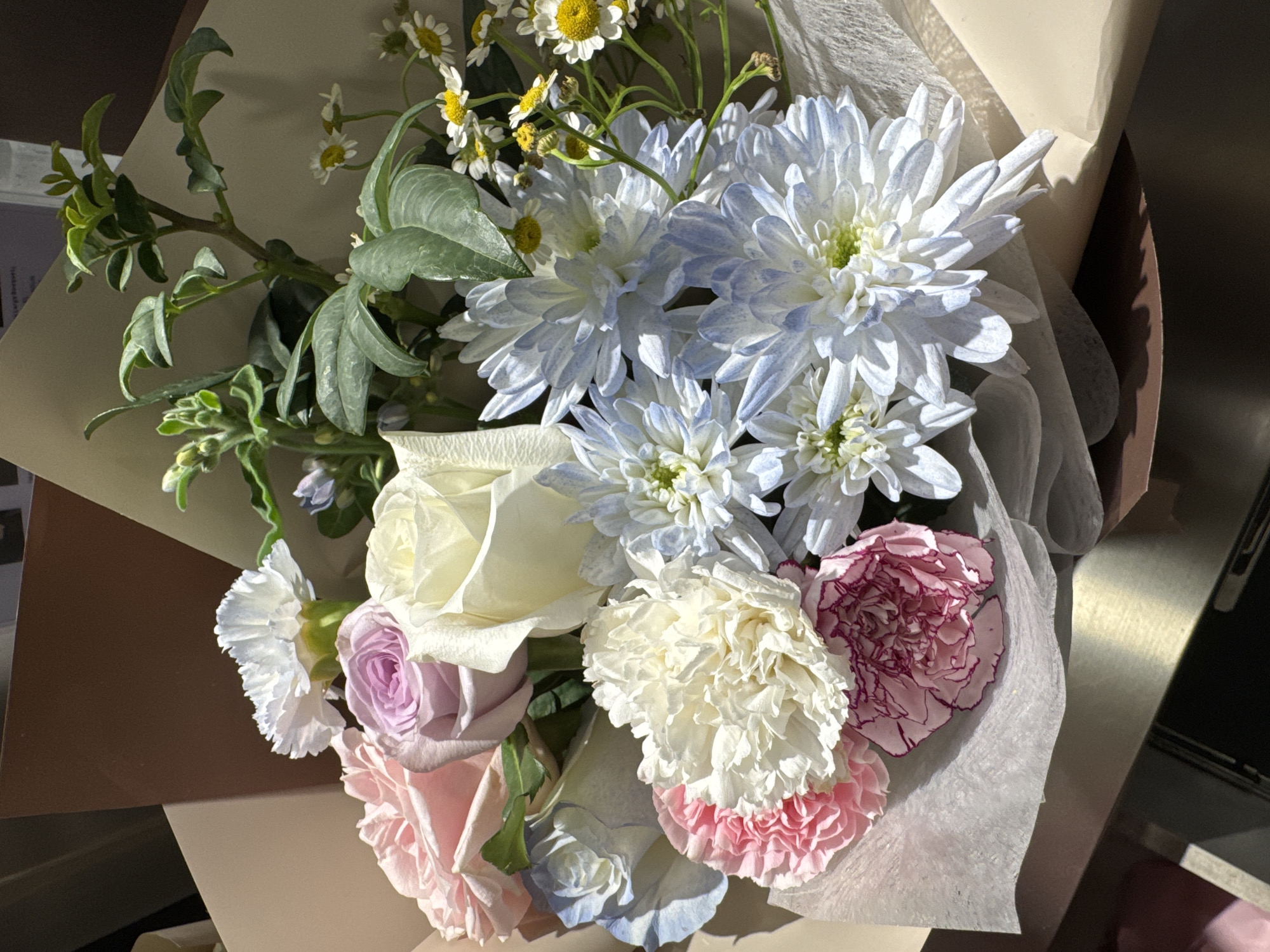Kuala Lumpur florist displays fresh bouquets on a Sunday morning