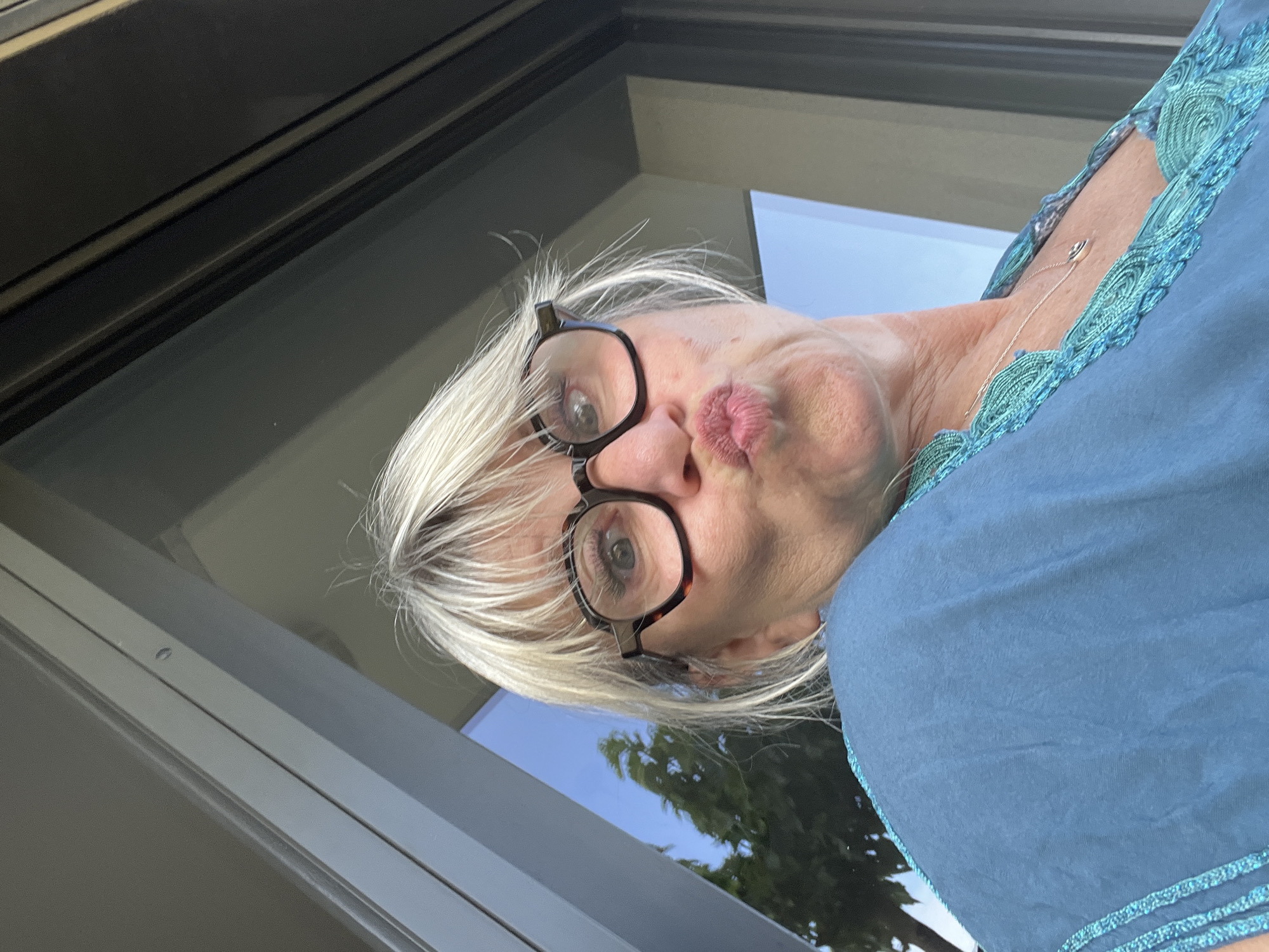 Woman poses for photo on patio in Chambœuf