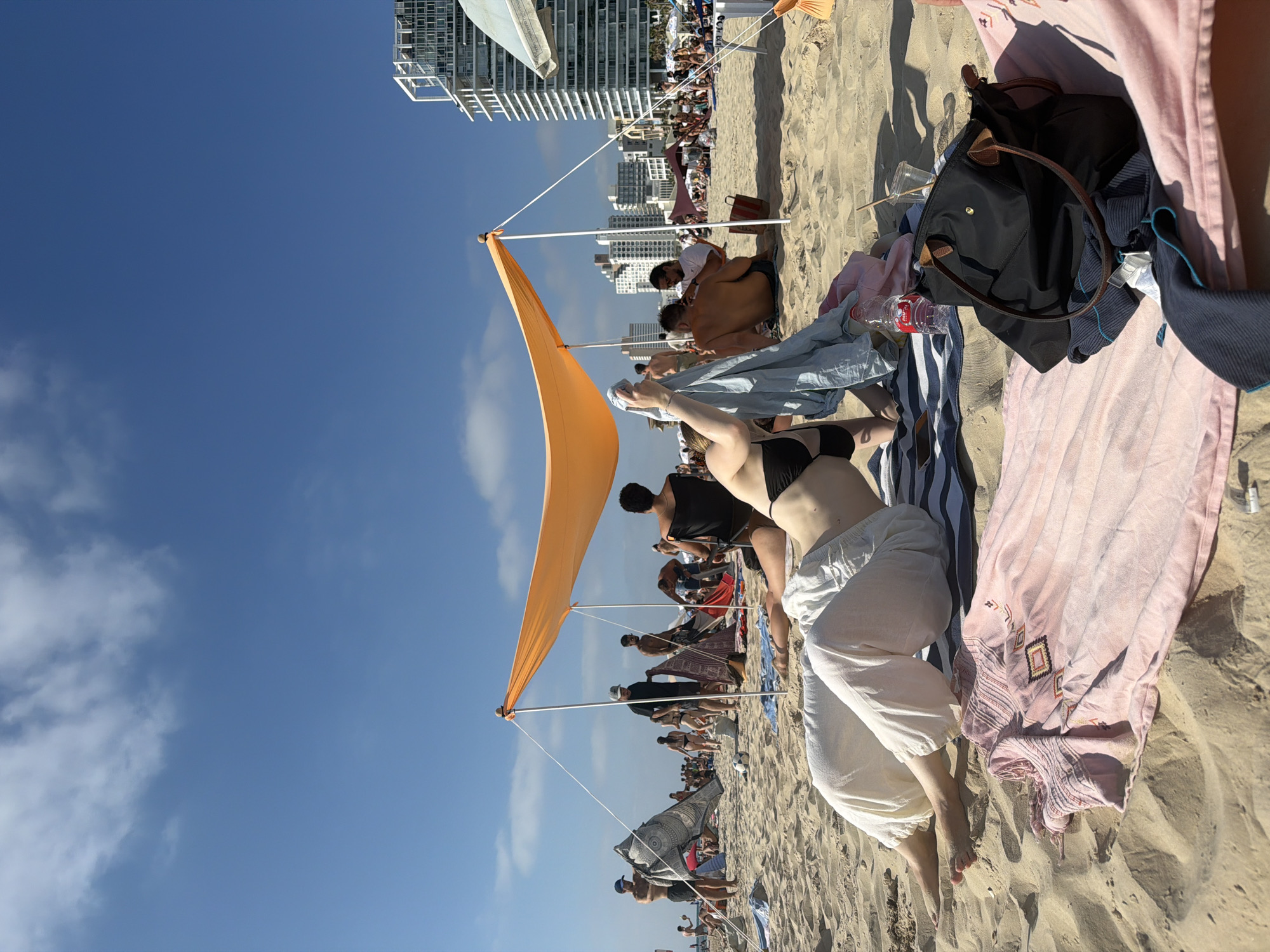 Sun, selfies, and flowers on a Tel Aviv beach afternoon