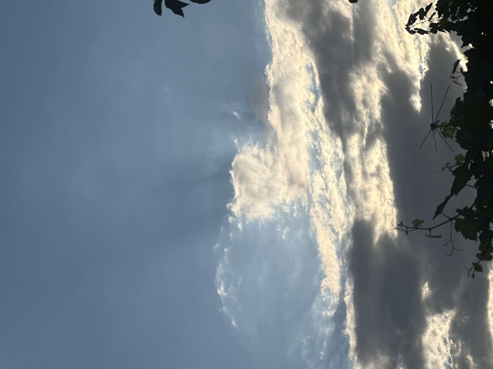 Dramatic sky and antenna silhouettes over Kogon City