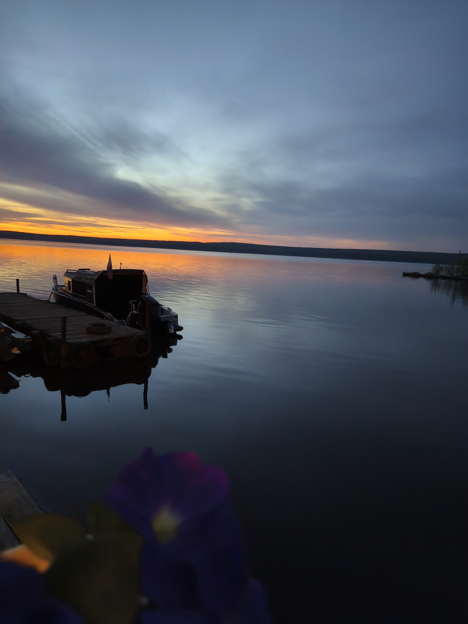 Sunset observed over Kama Reservoir waterfront in Chaikovsky, Russia