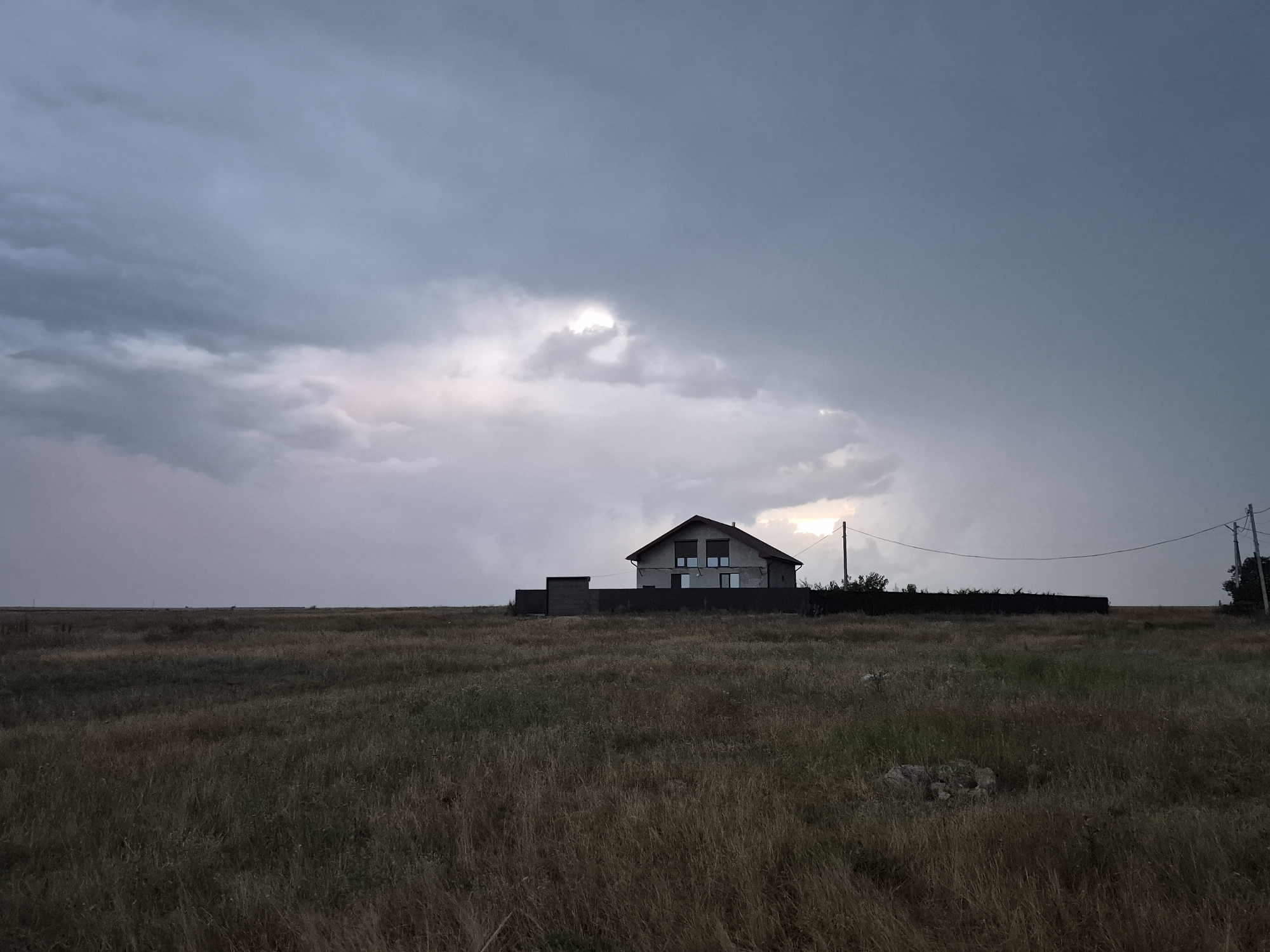 Dusk settles over quiet fields and rooftops in Ceadîr-Lunga