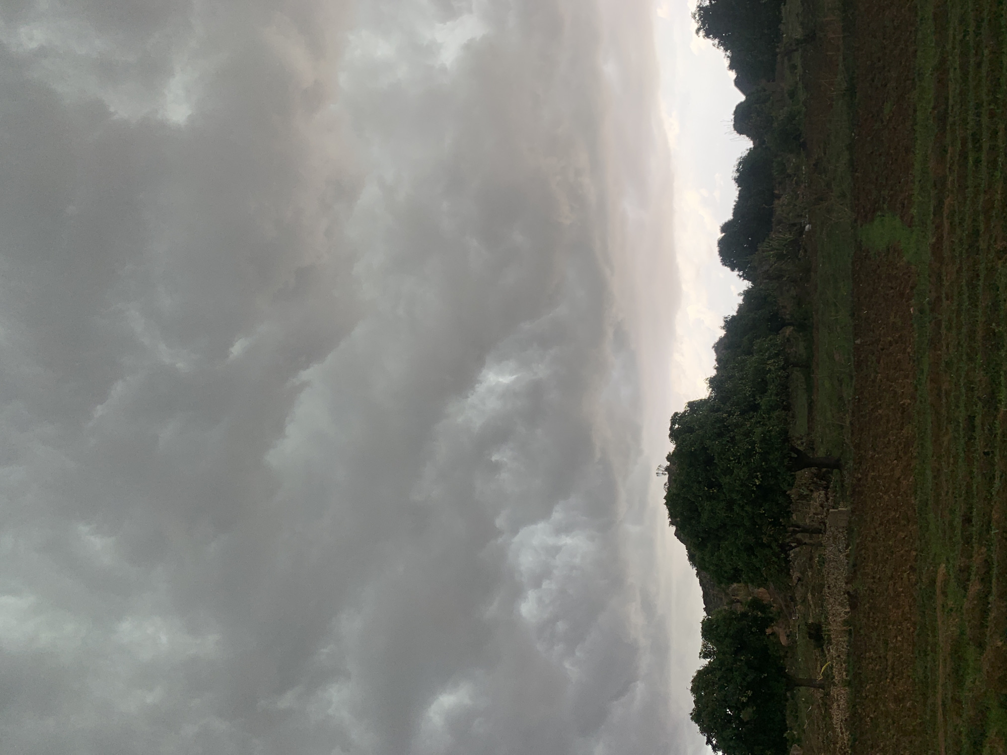 Rural life documented in Gwafan, Nigeria amid overcast afternoon