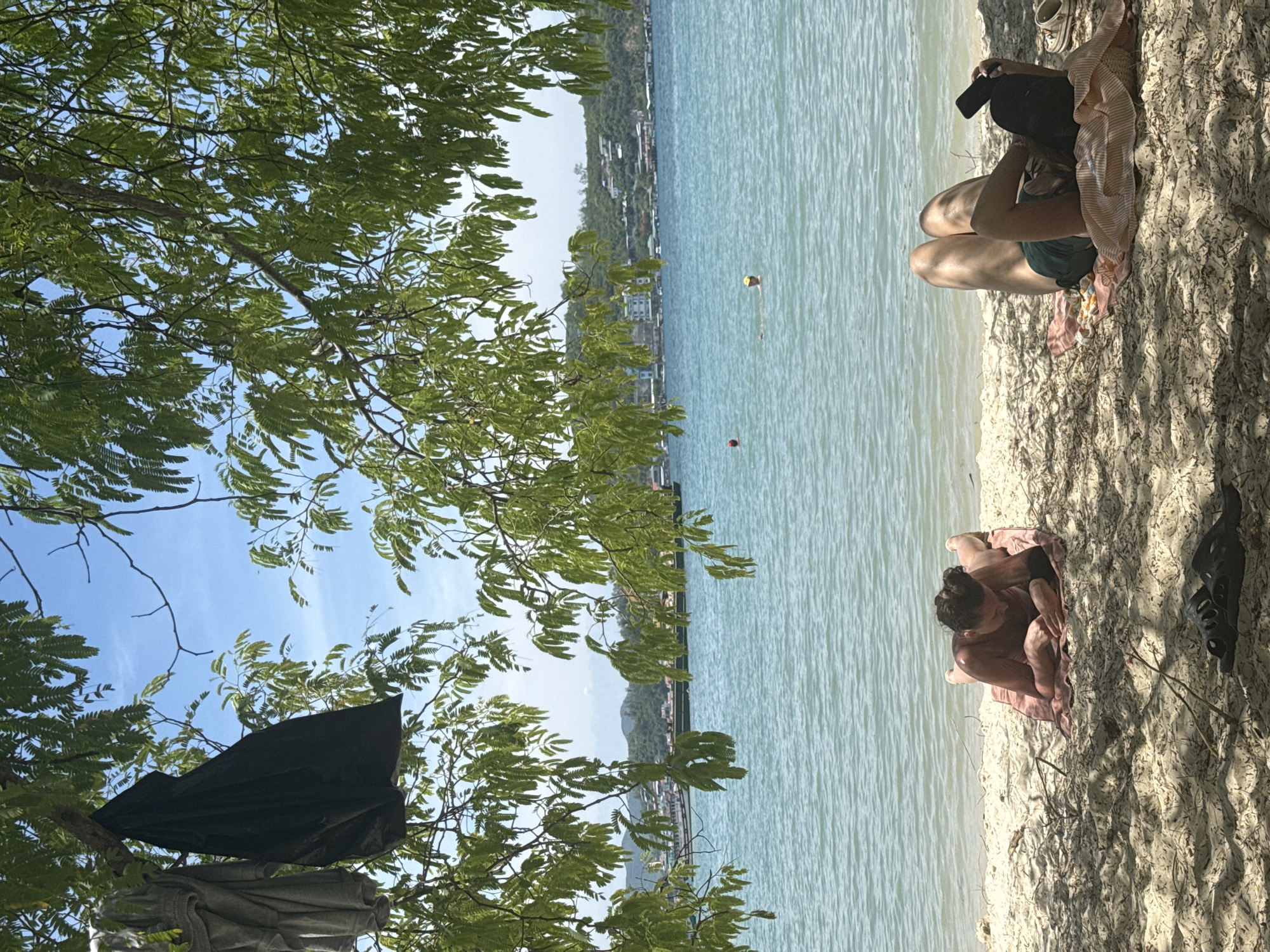 Lazy morning on Nha Trang beach, sun and turquoise water