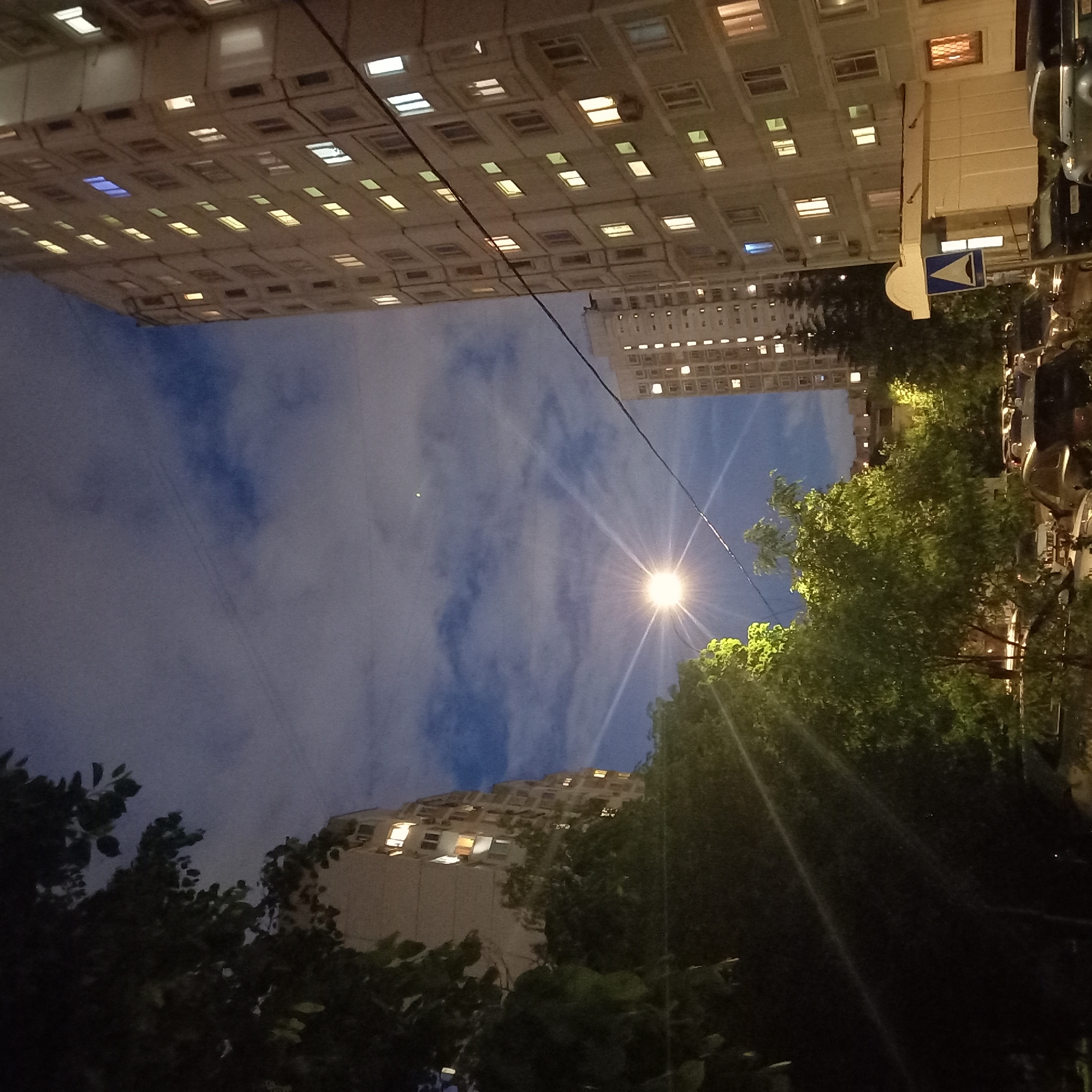 Moscow residents document quiet evening scenes around illuminated apartments
