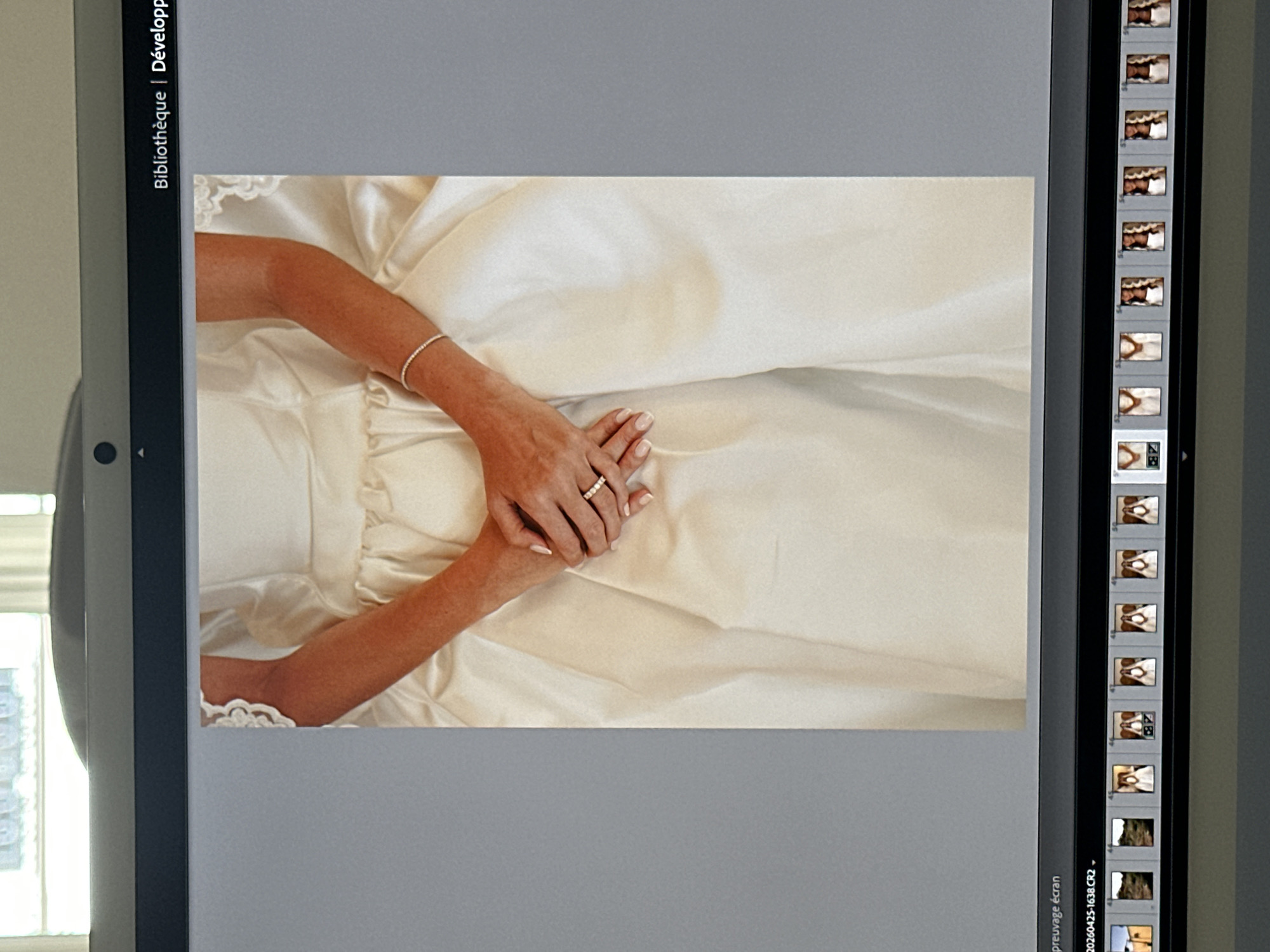 Bride's wedding ring photographed on dress in Paris