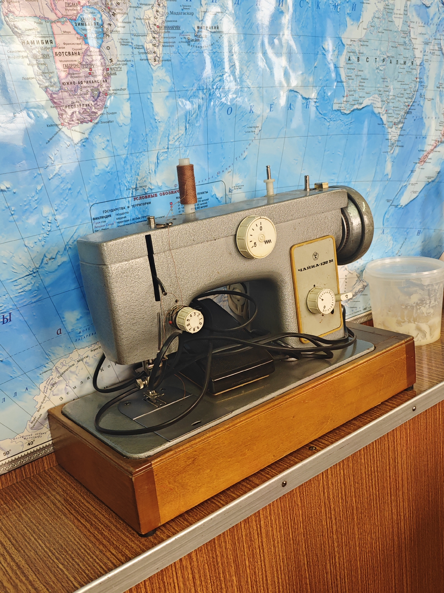 Handmaking lace-trimmed curtains with a vintage sewing machine in Krasnoyarsk