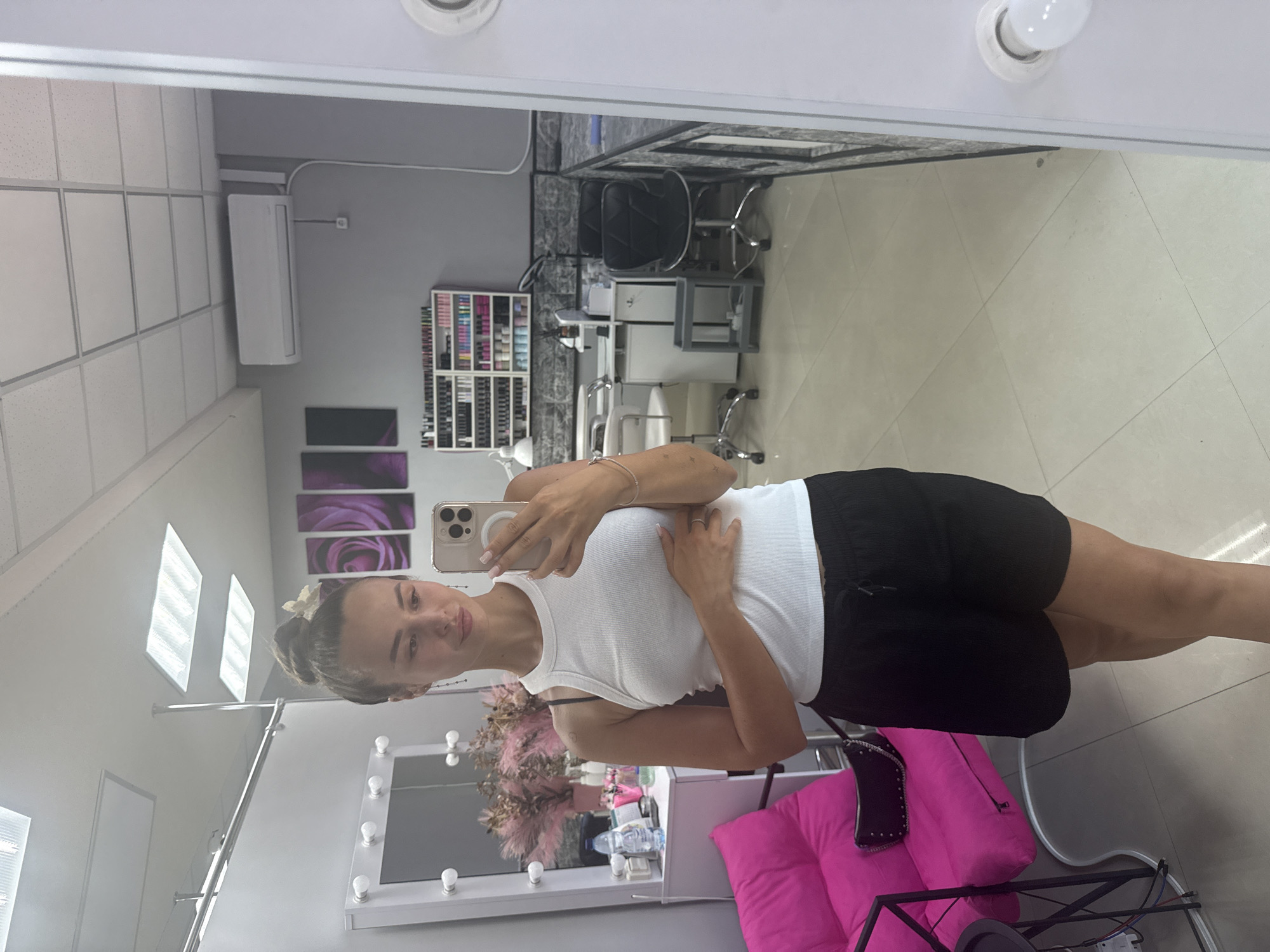 Inside a Kyiv nail salon, mid-visit mirror selfie.