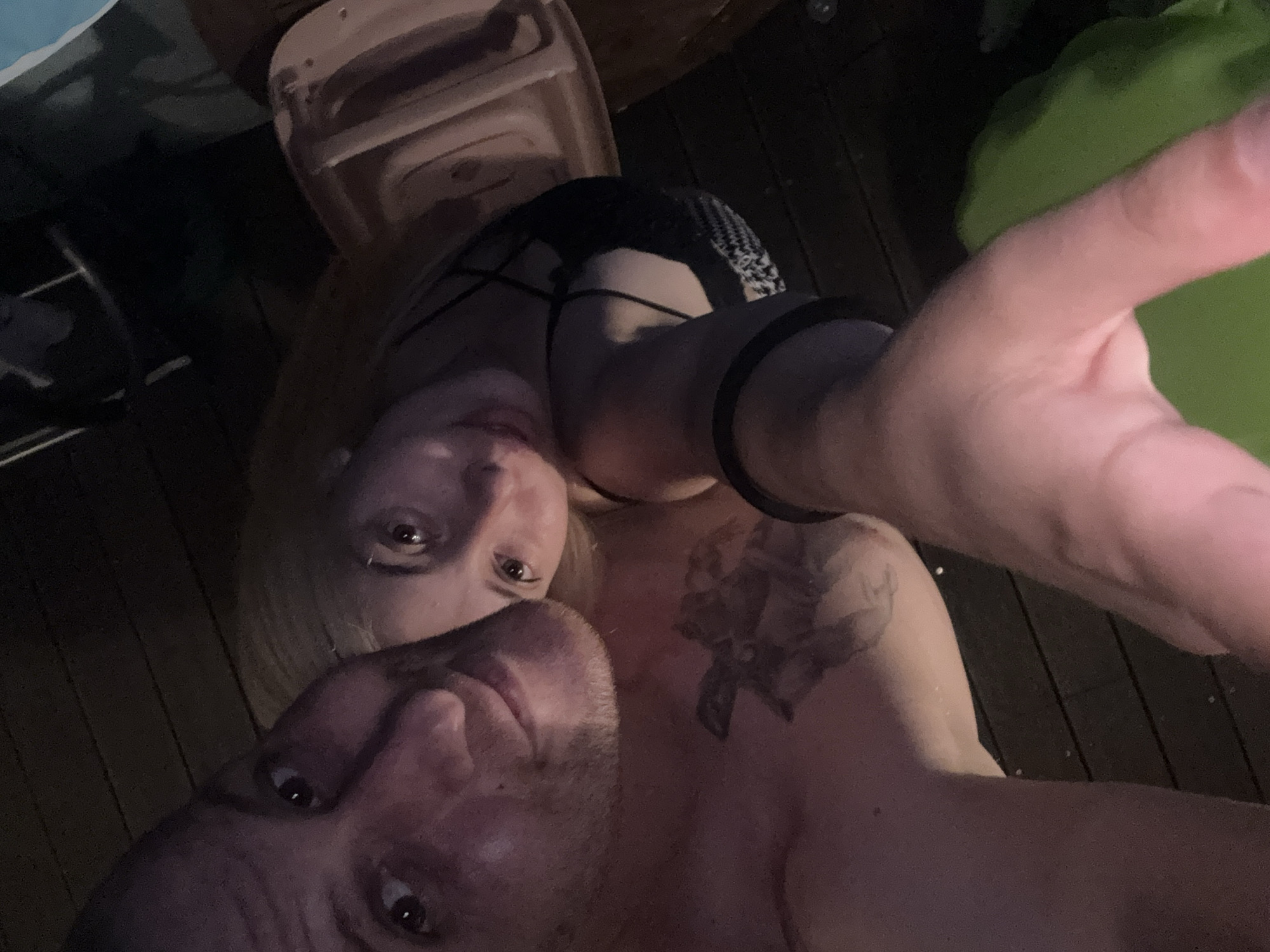 Deck hangout and moon rising over a wooded property at night