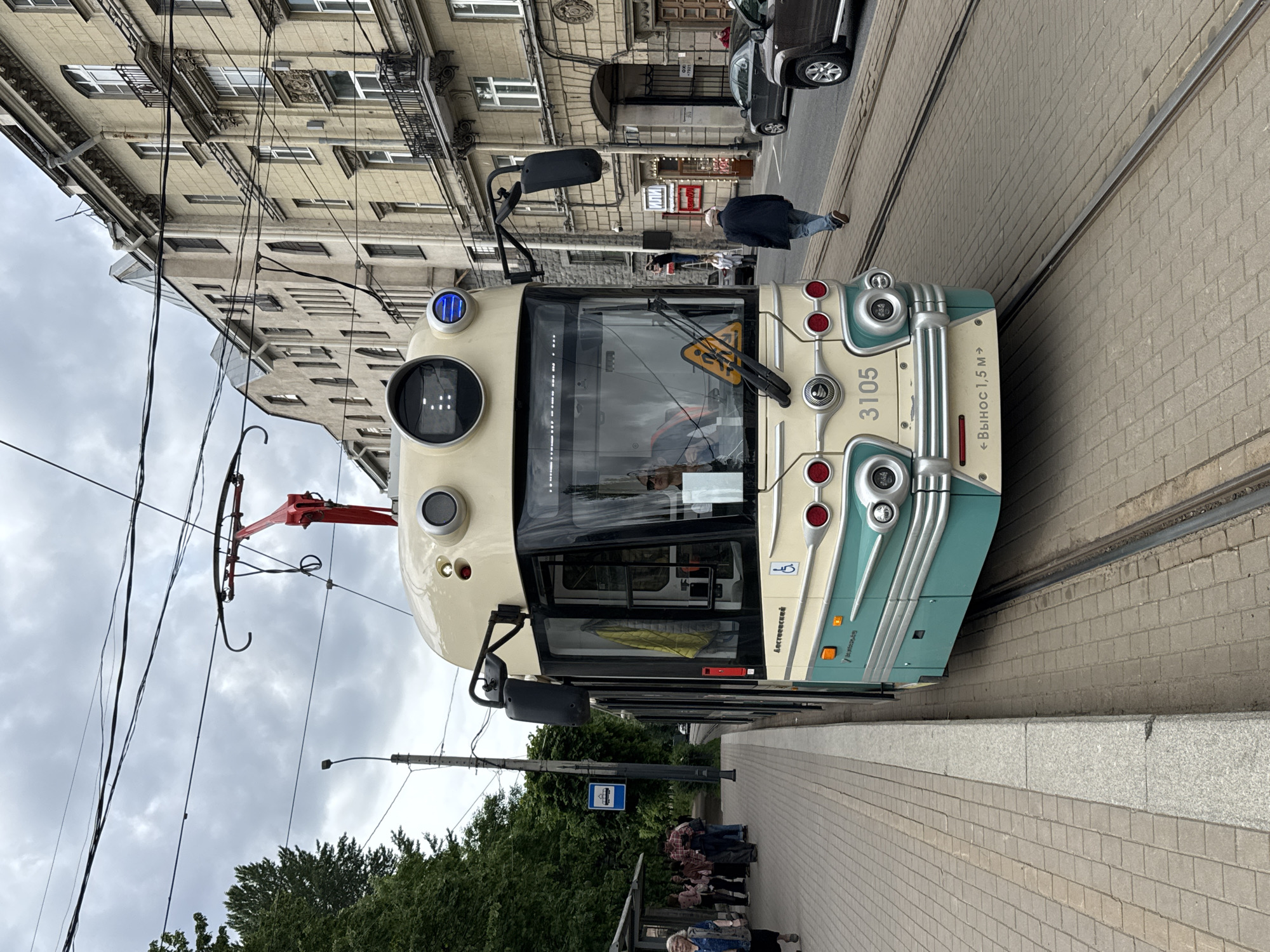 Tram 3105 stops near Saint Petersburg Mosque under overcast skies