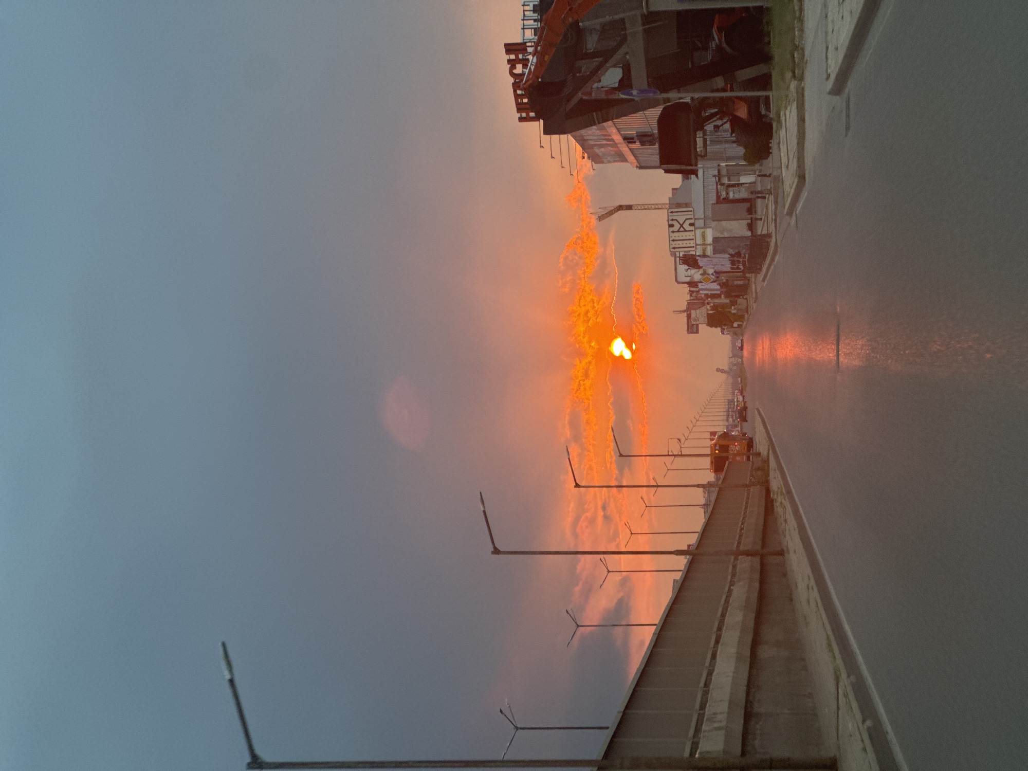 Sofia street glows under a dramatic summer sunset sky