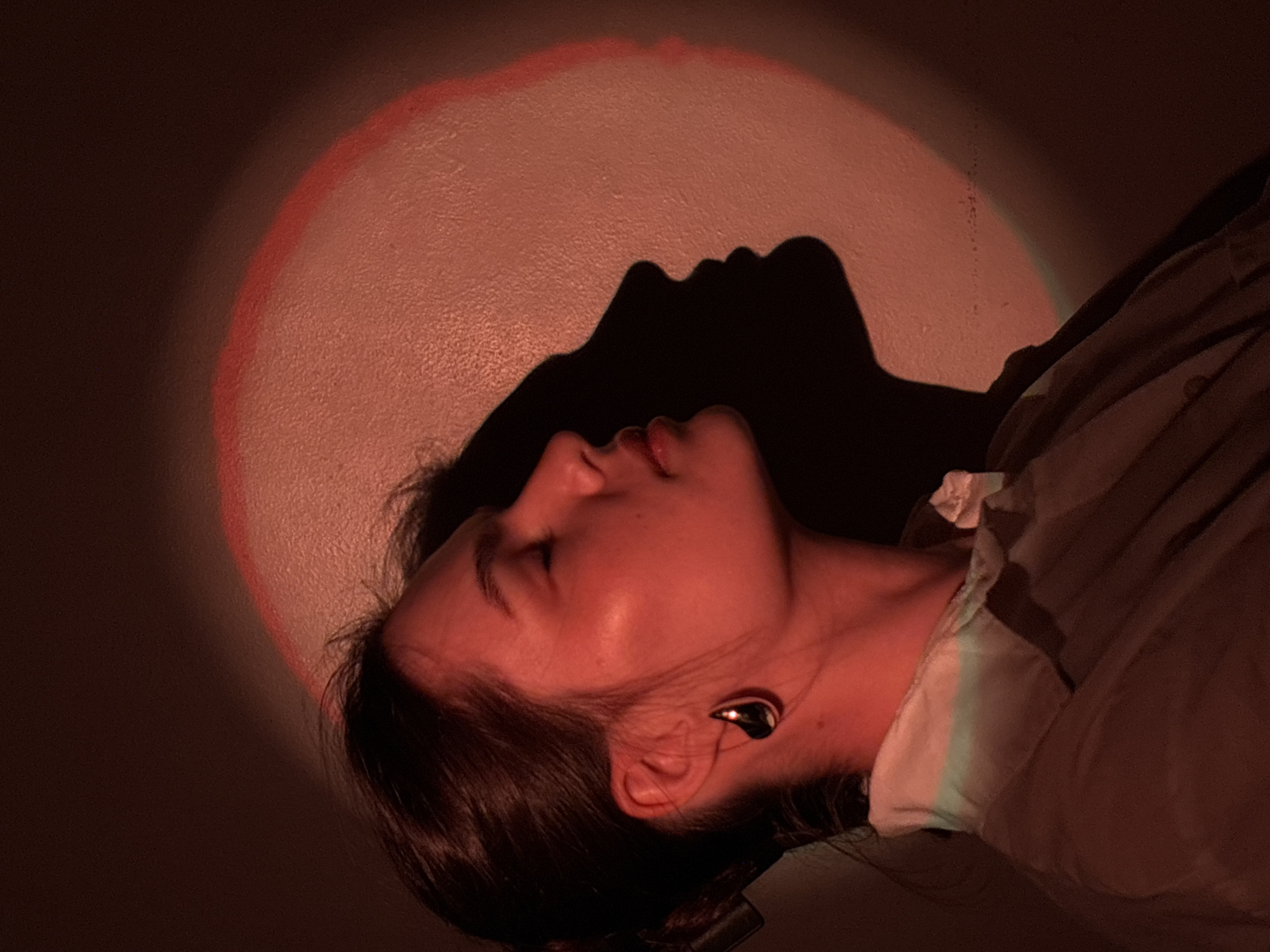 Late-night self-portrait session with colored lights in Chaikovsky