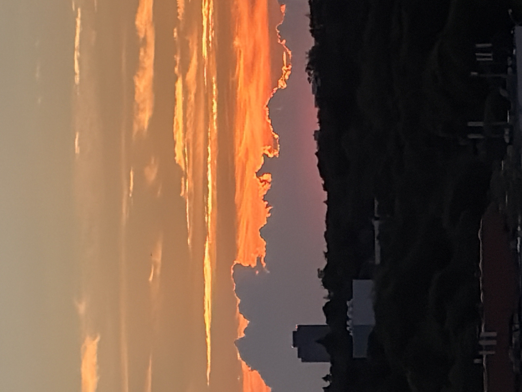 Toronto skyline glows under a vivid summer sunset