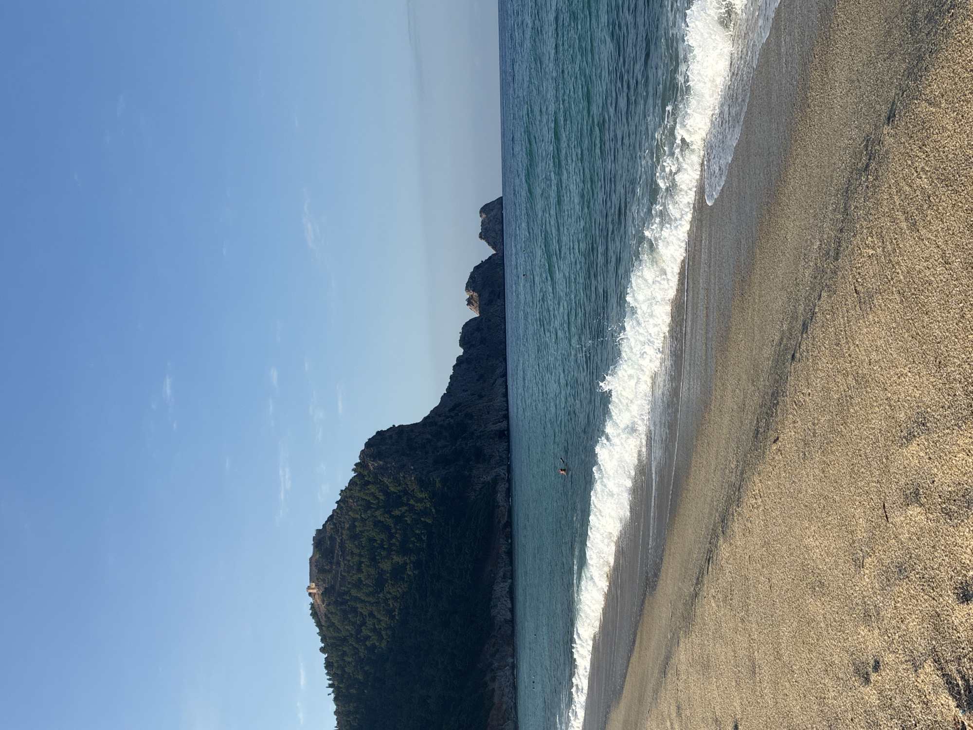 Alanya beach scene with boats and castle backdrop