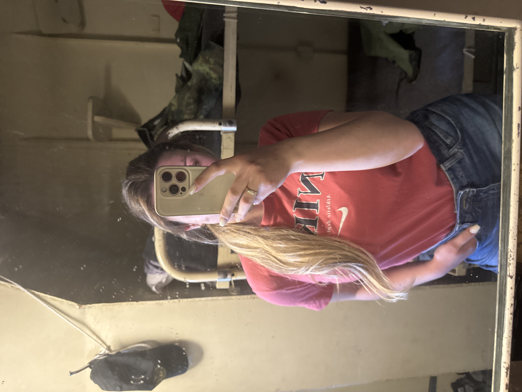Woman takes mirror selfie in red shirt in Varna